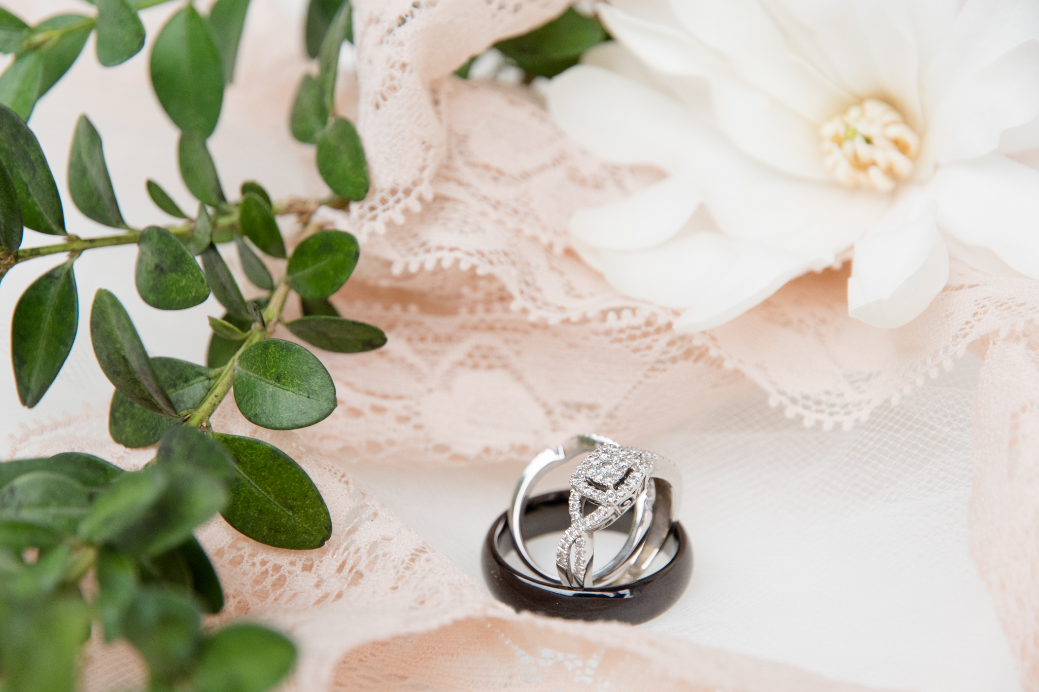 Wedding Rings sit with flowers and lace
