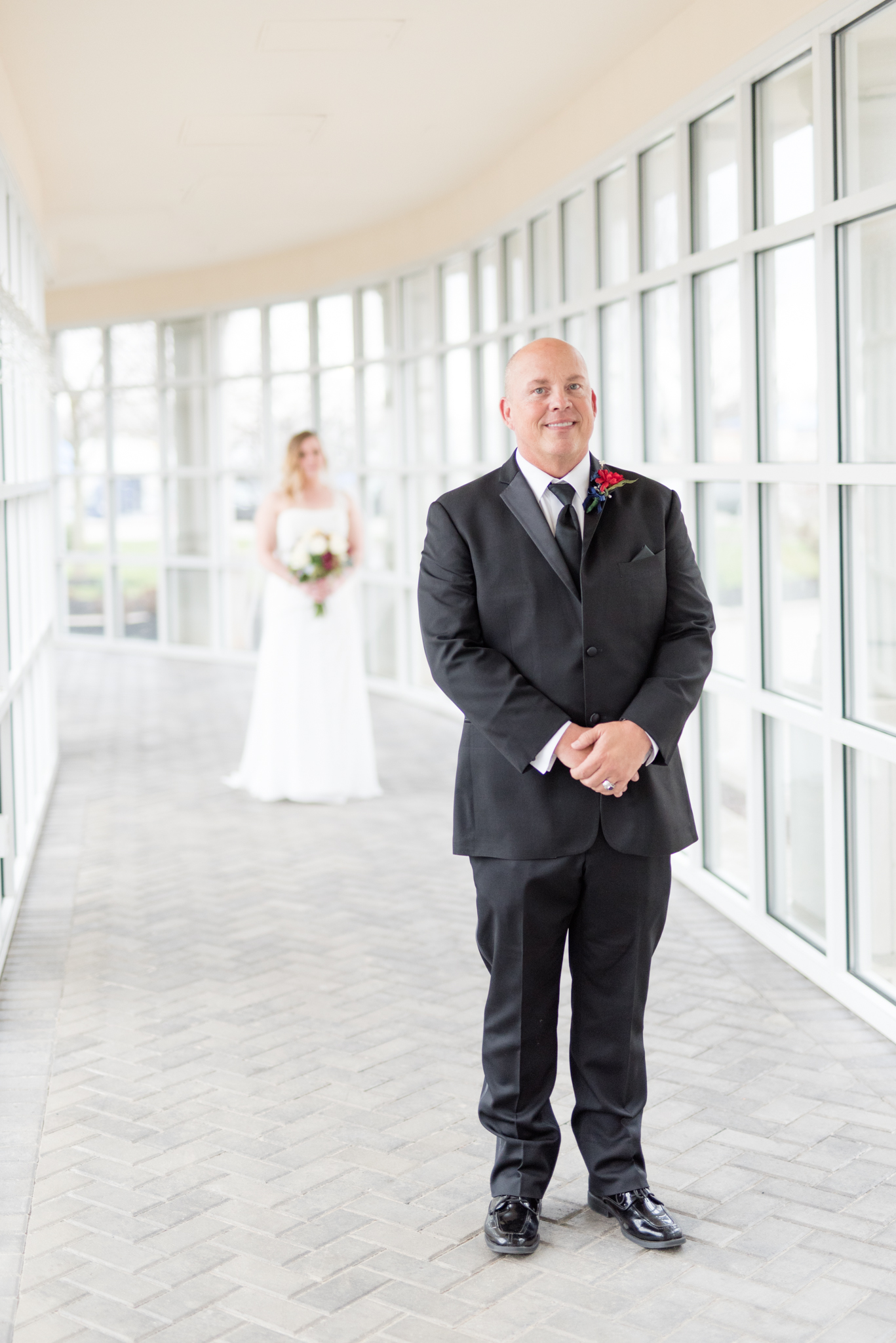 Bride's father waits to see her for the first time.