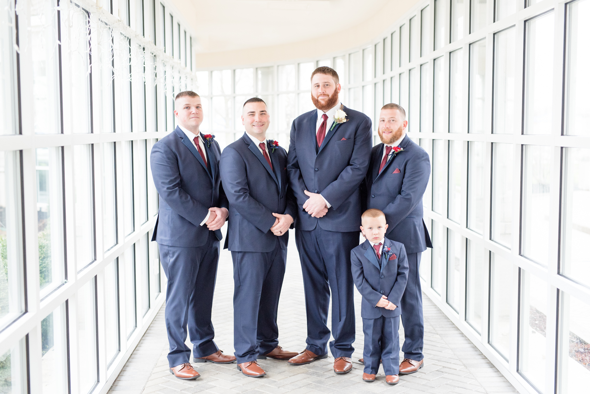 Groom's Party smiles at camera.