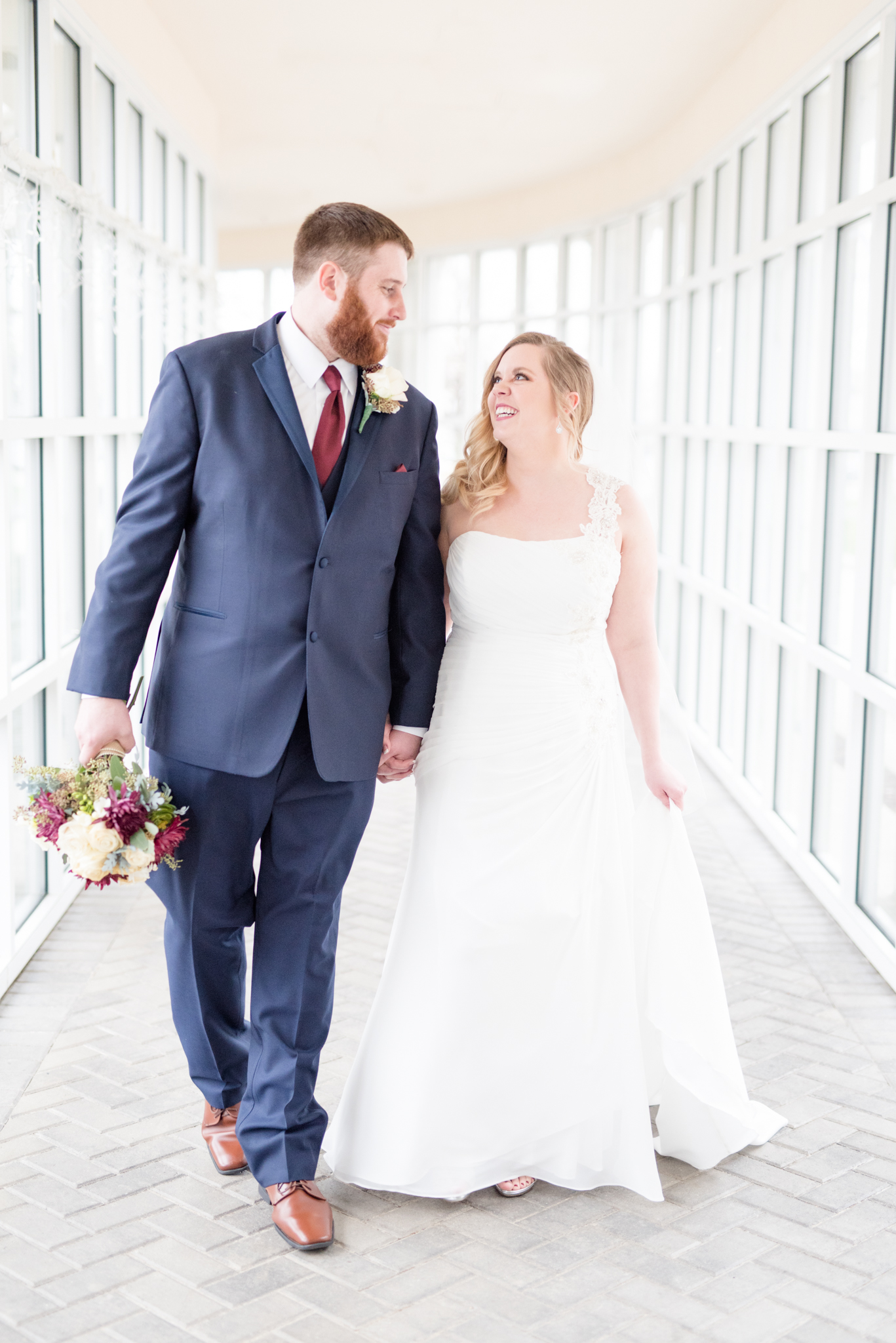 Bride and groom walk together.