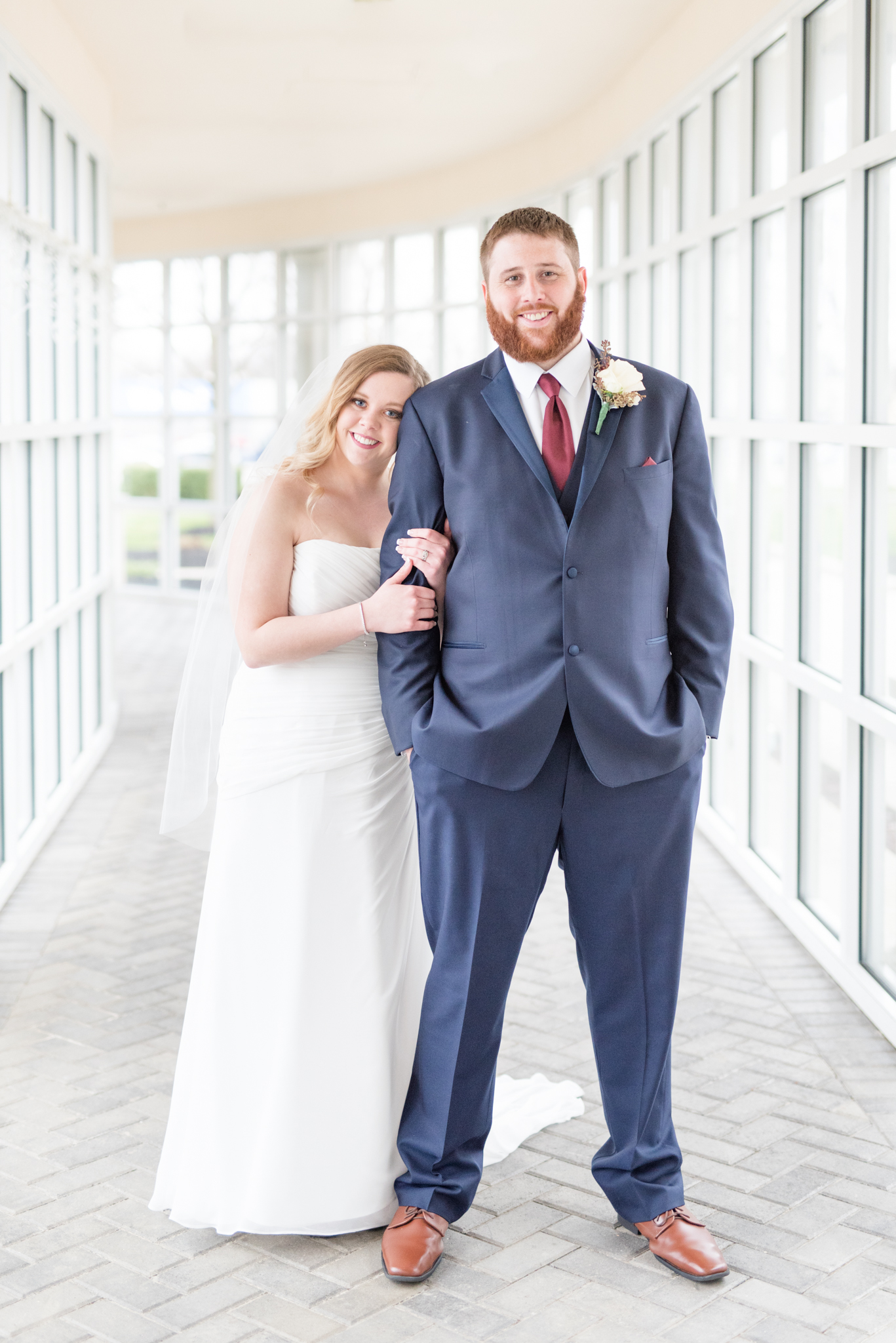 Bride leans head on groom.