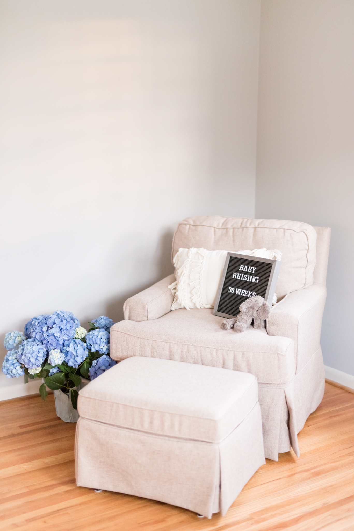 Rocking chair and baby sign.