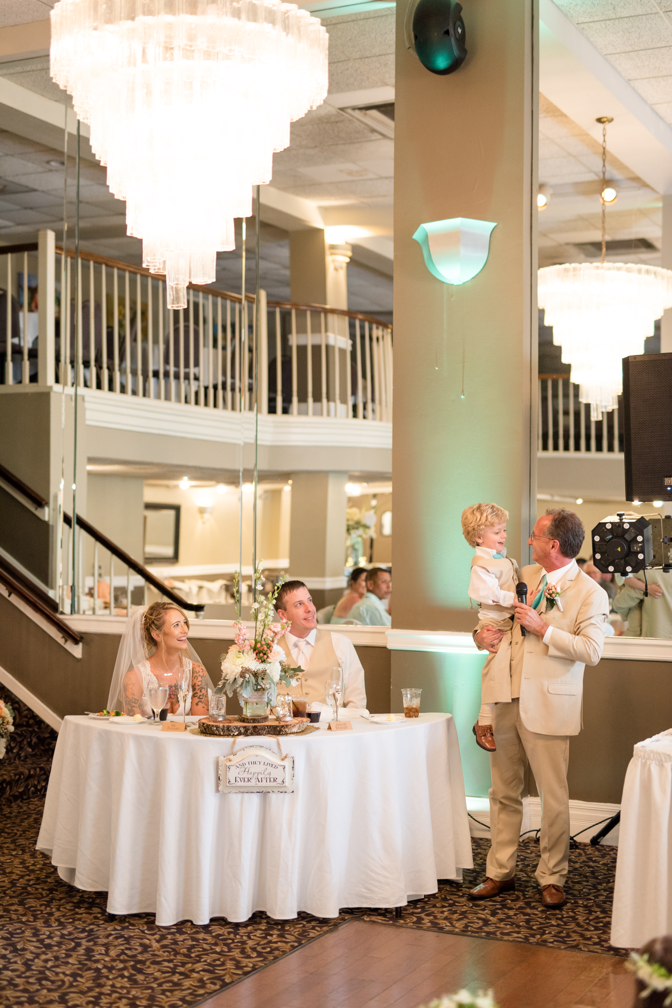 Bride's father speaks at reception.