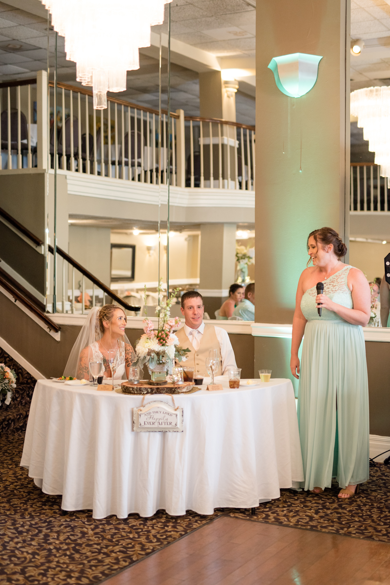 Maid of honor speaks at reception.