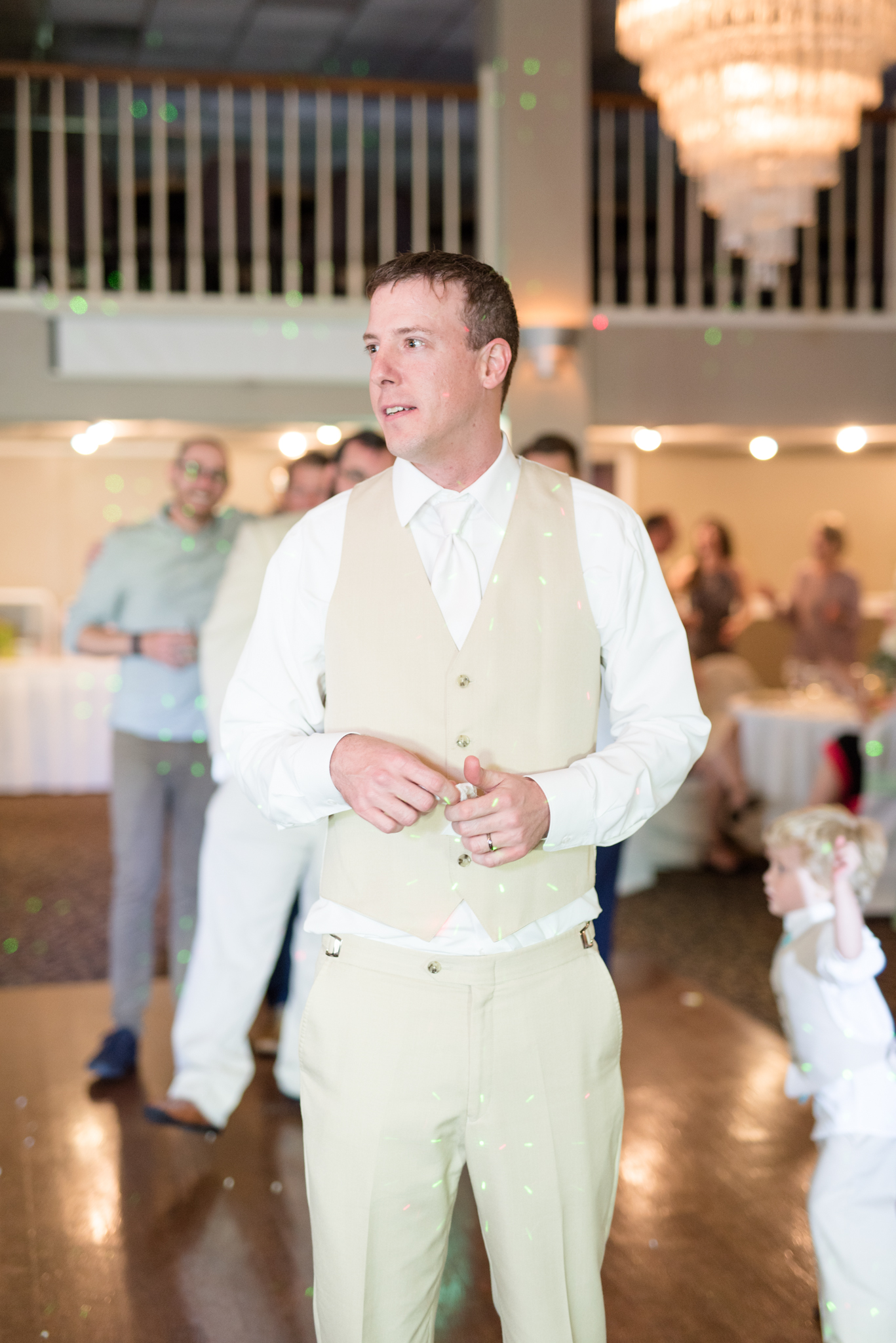 Groom throws garter.