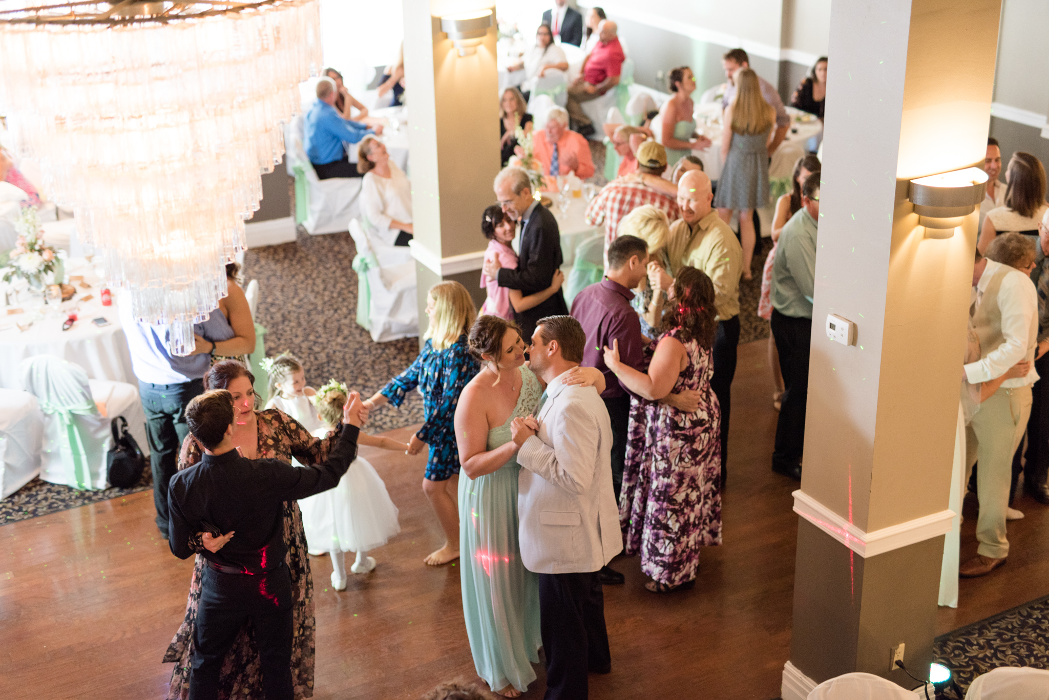 People dance at wedding reception.