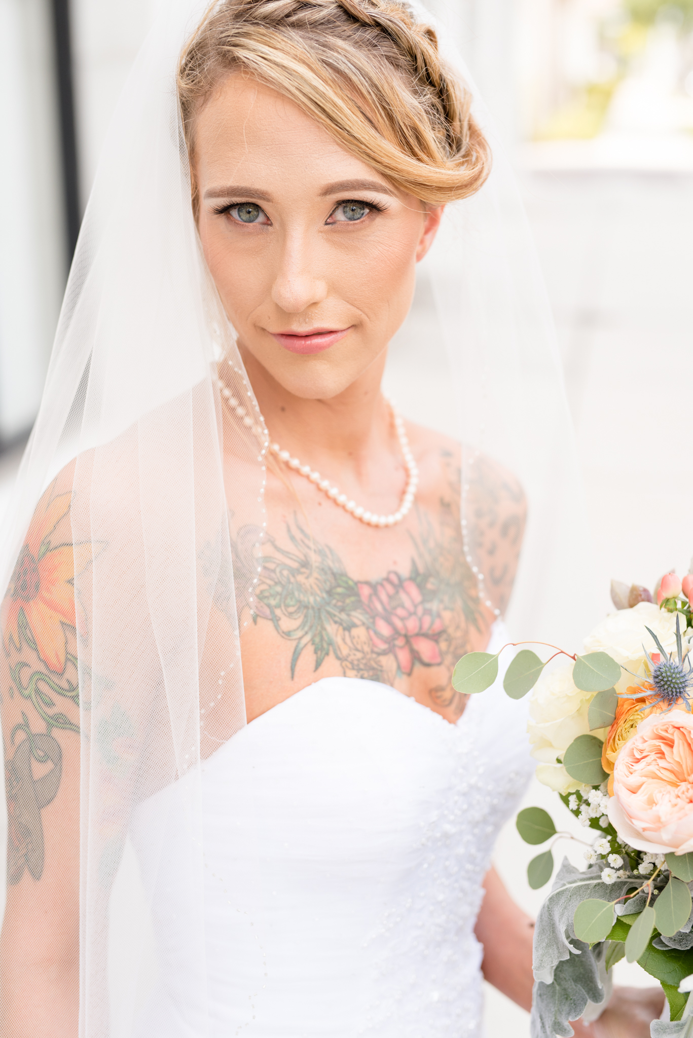 Bride looks at camera during bridal portraits.