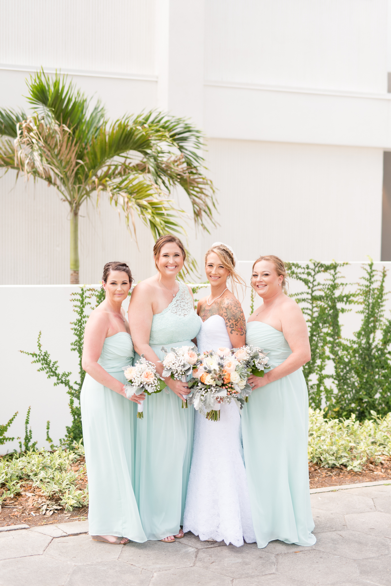 Bridal party looks at camera and smiles.