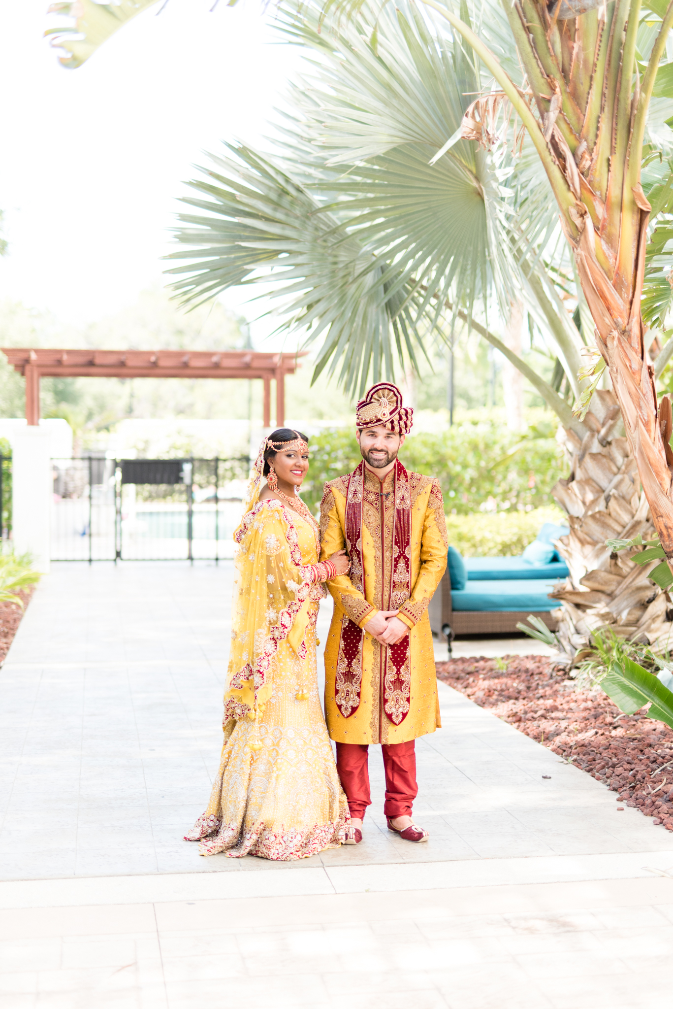 Bride and groom smile at the camera.