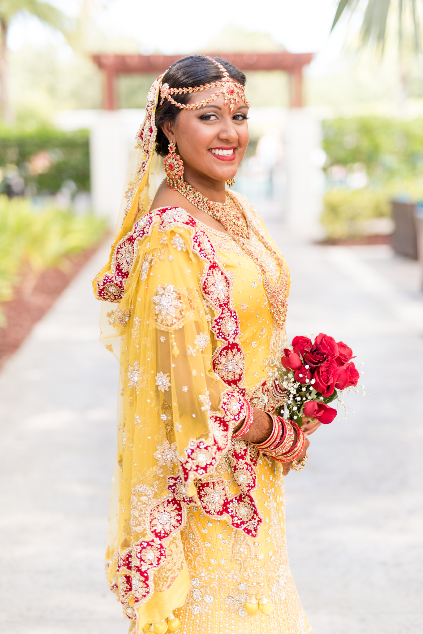 Indian Bride smiles at camera.