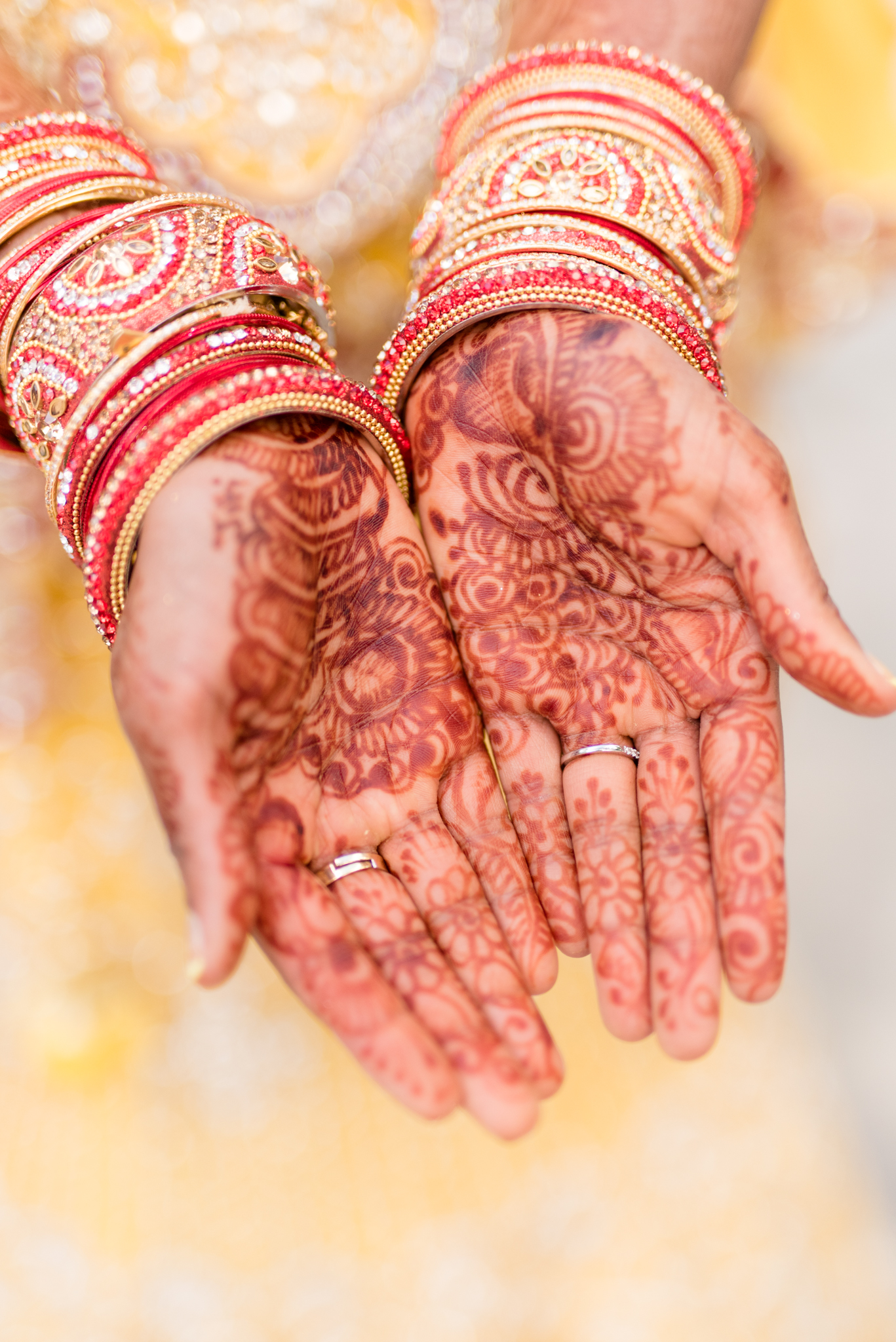 Bride shows off the henna on her hands.