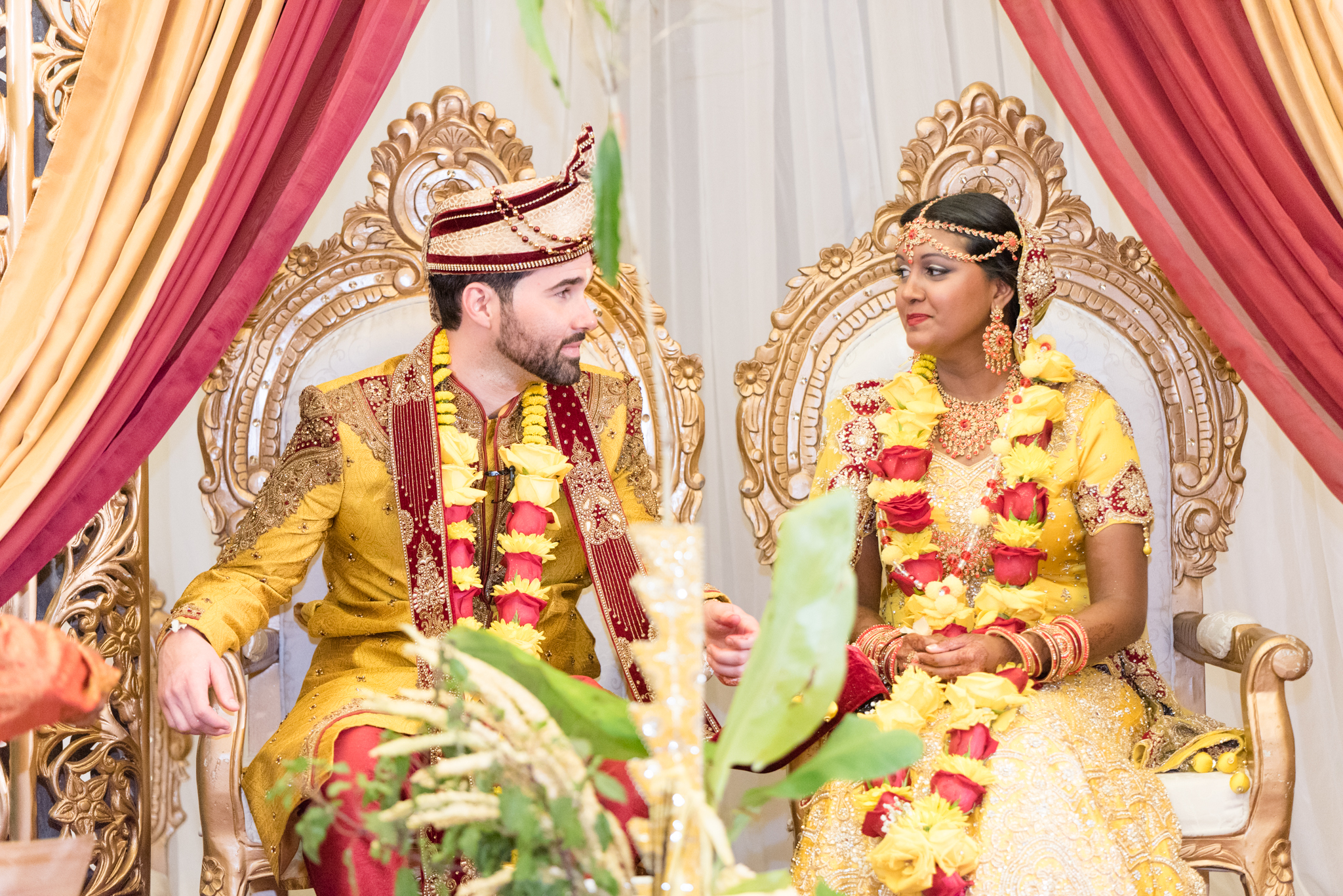 Bride and groom look at each other during their Indian wedding.