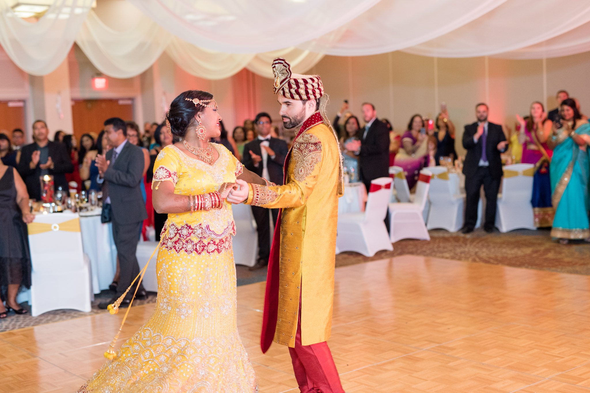 Bride and groom dance at reception.