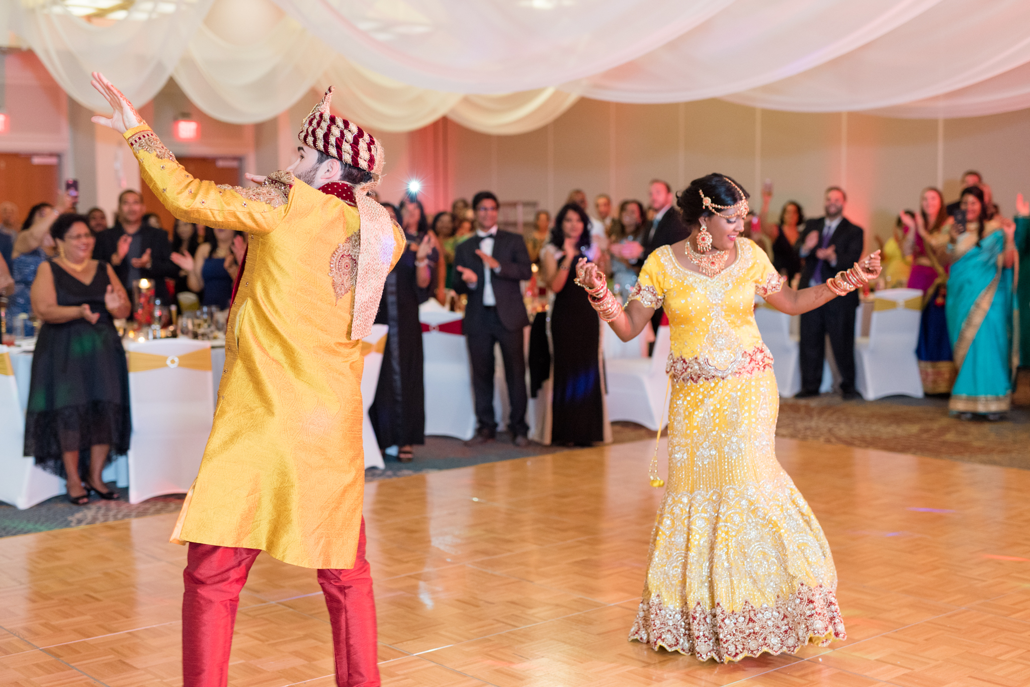 Bride and groom dance at wedding reception.