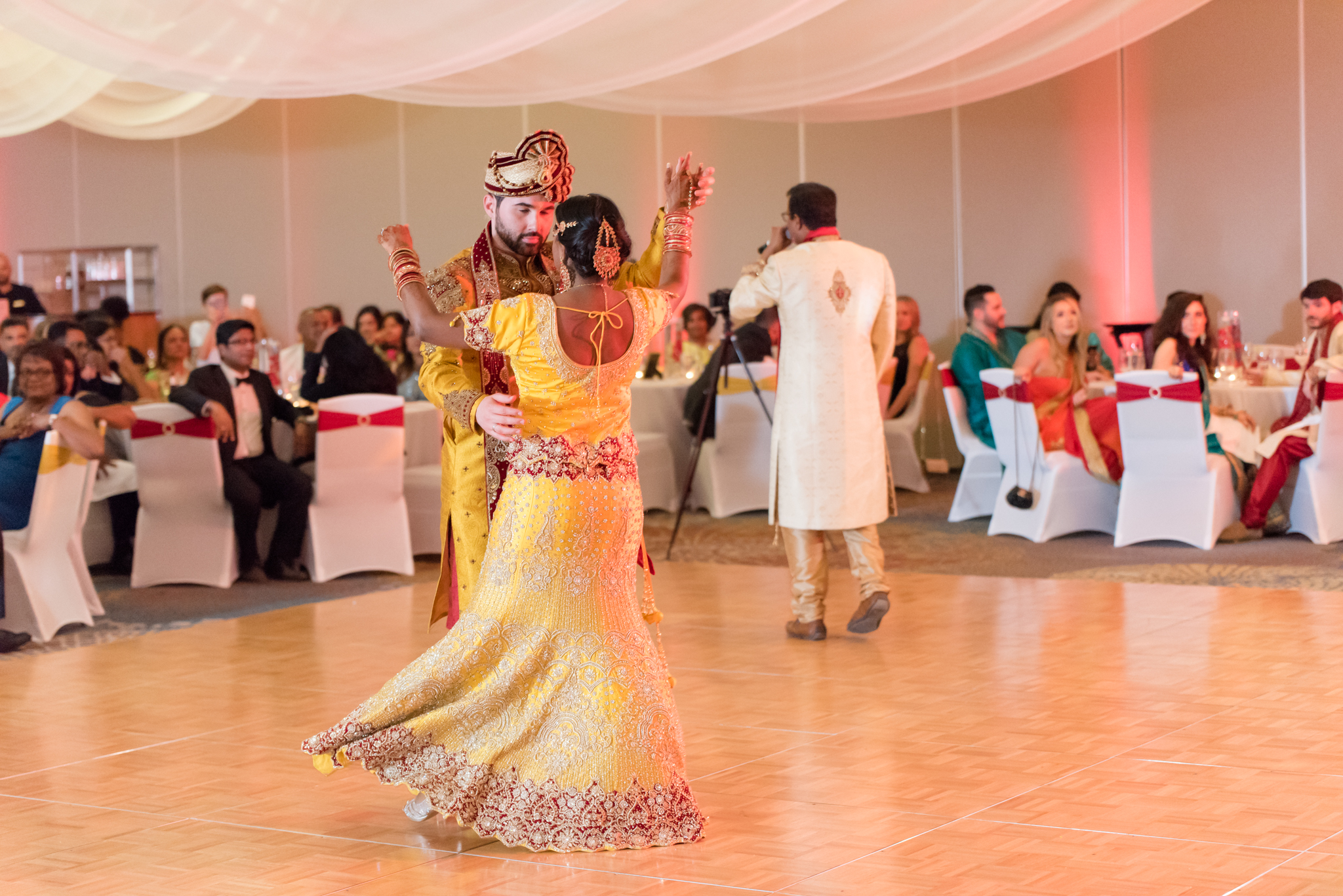 Bride and groom dance at reception.