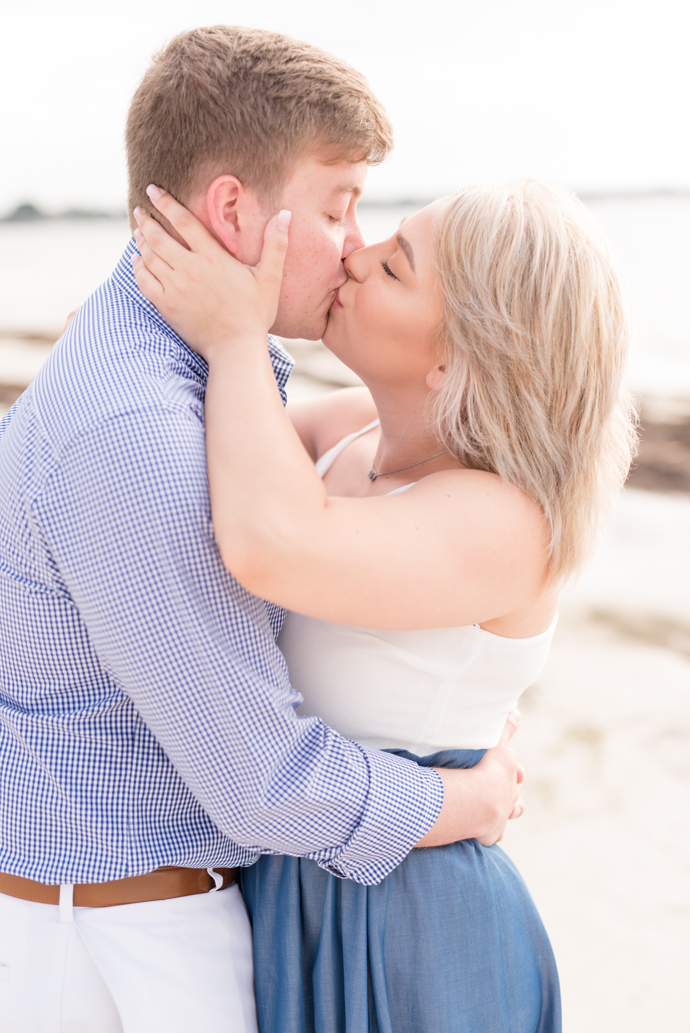 Couple kisses on St. Petersburg beach.