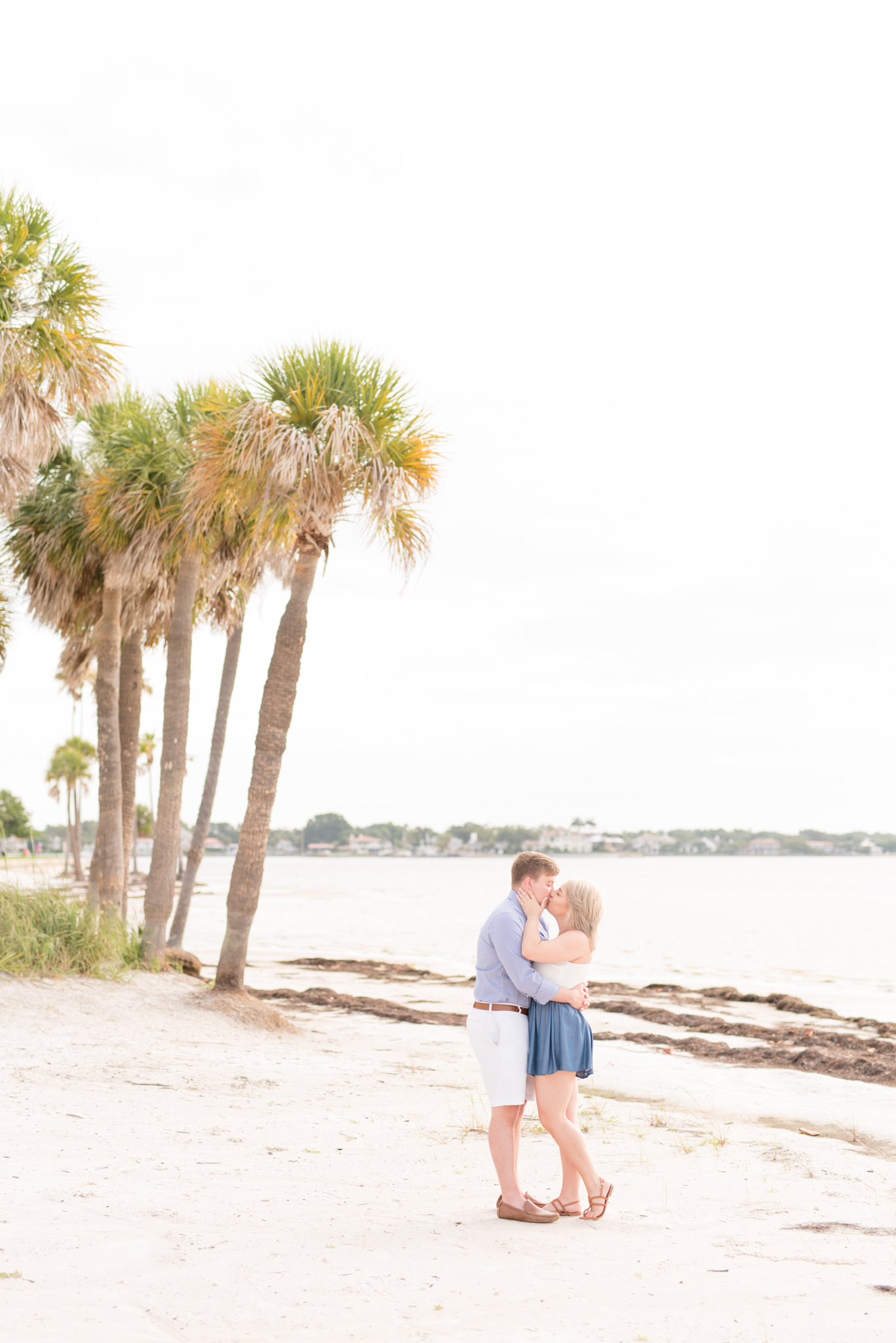 Couple kisses on Tampa beach.
