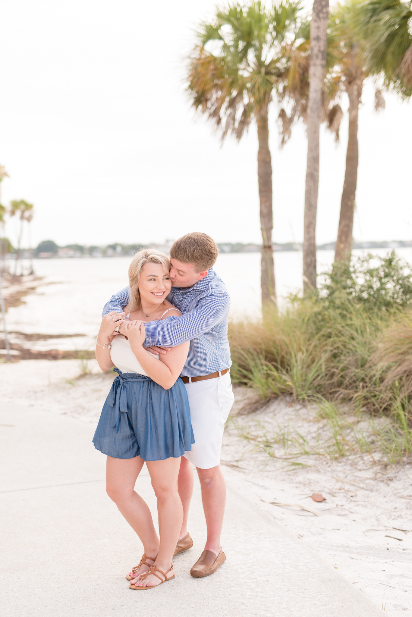 Couple hugs on St. Petersburg beach.