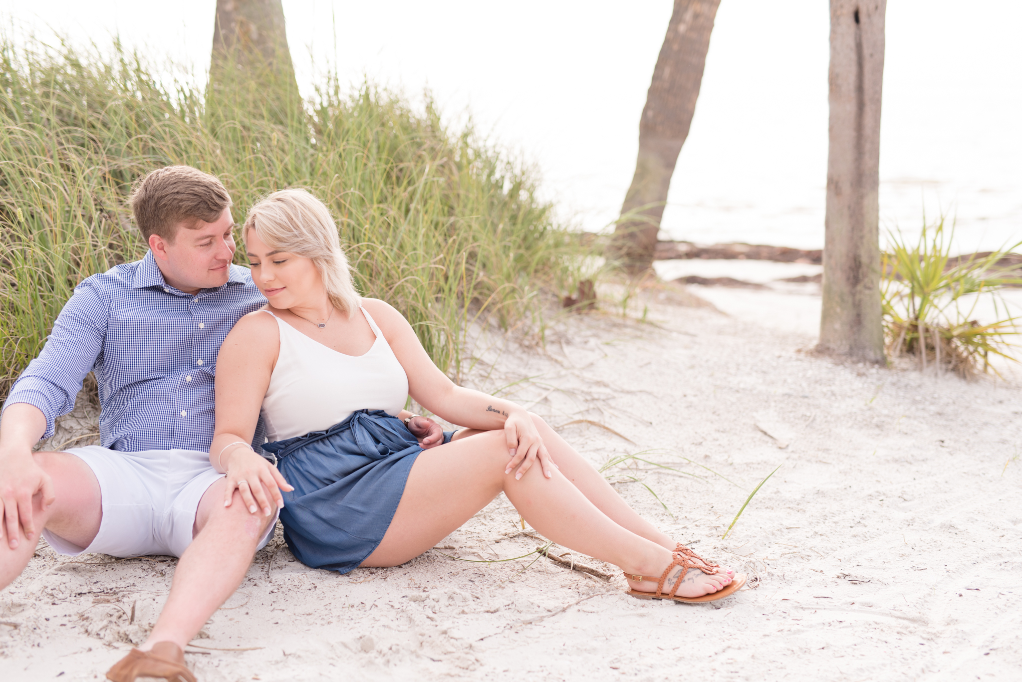 Couple sits on St. Petersburg beach.