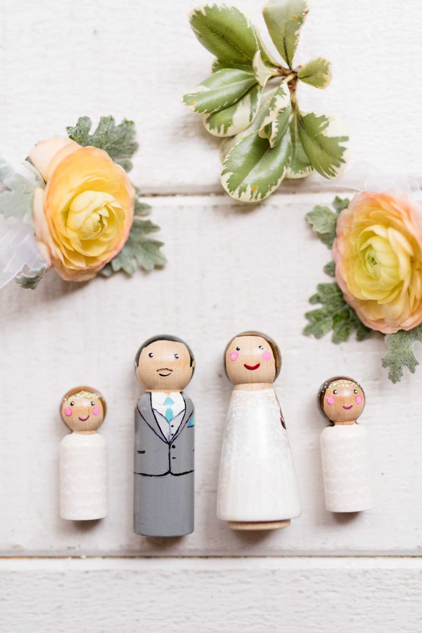 Hand painted cake toppers of the bride and groom.