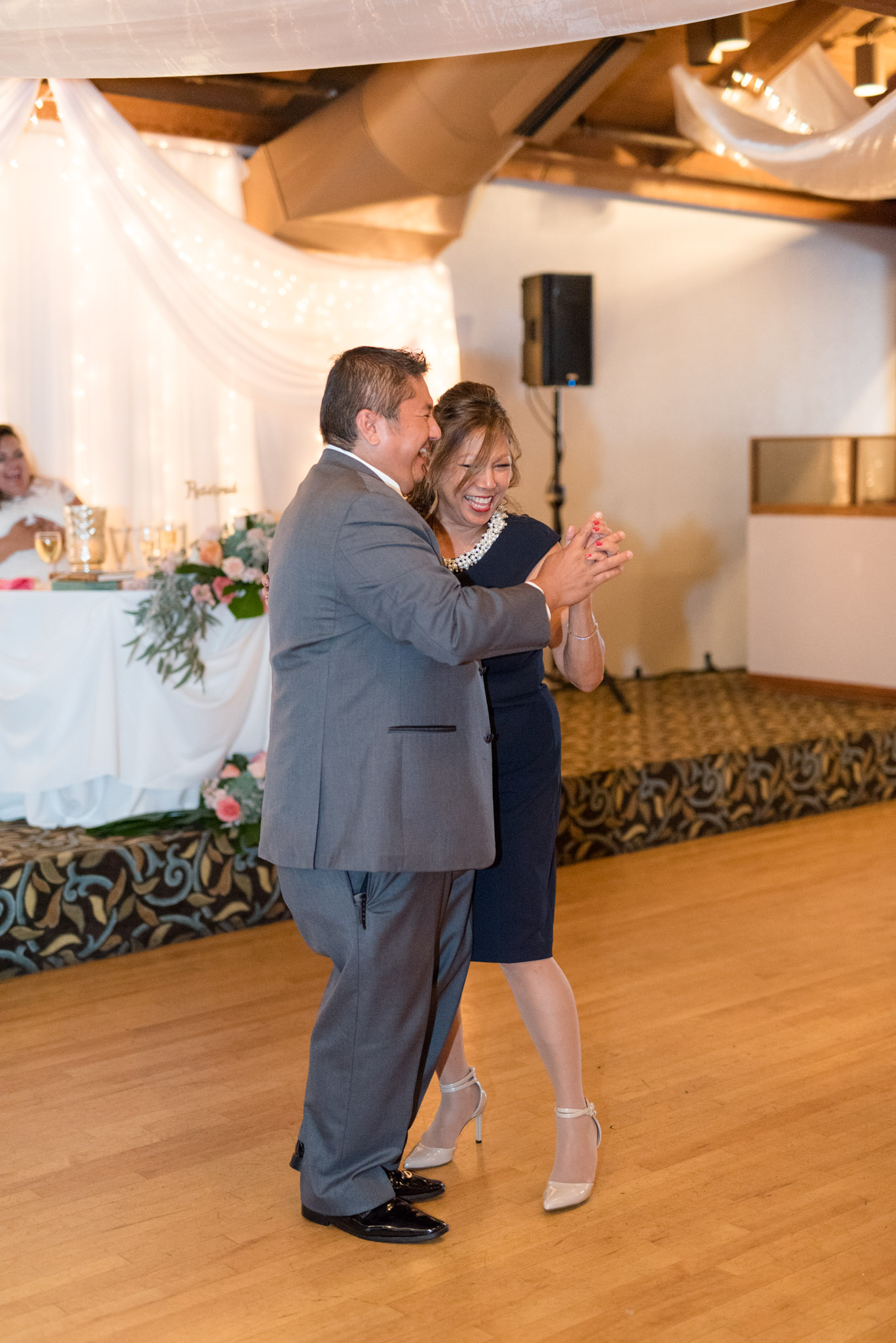 Groom and his mother dance at wedding reception.