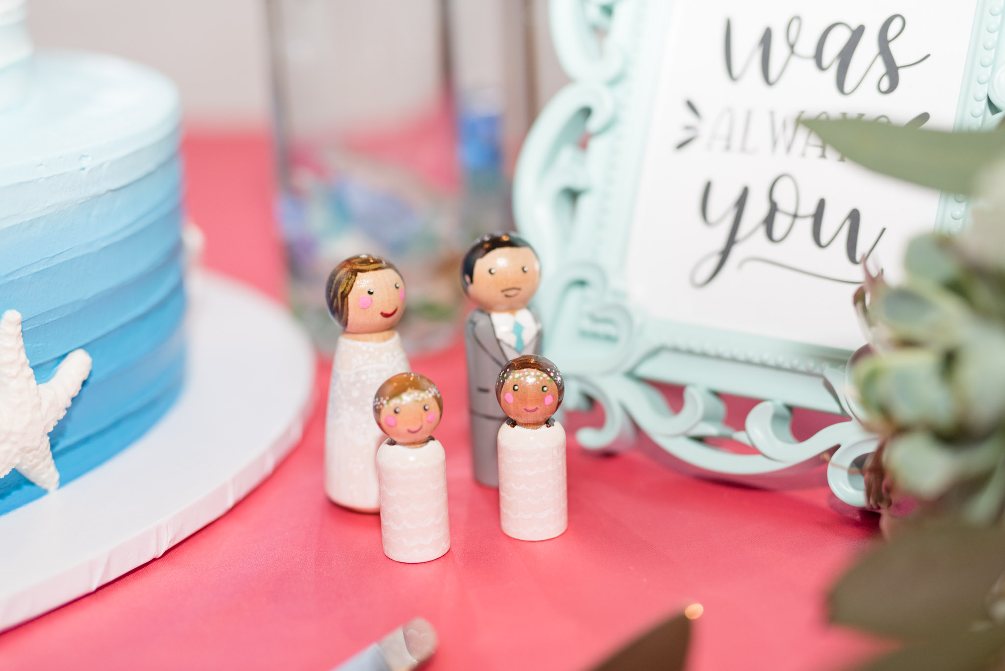 Bride and groom hand painted cake toppers.