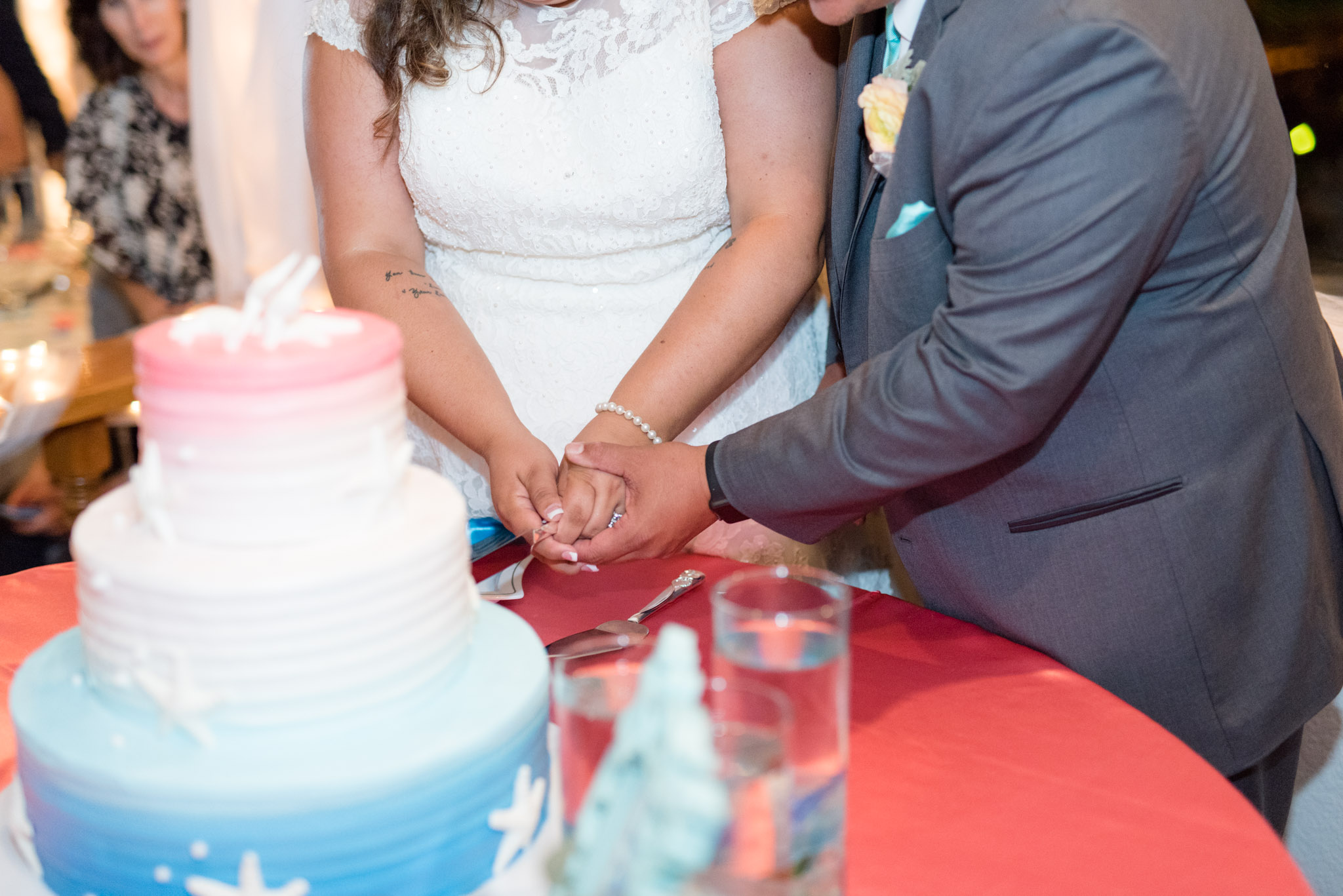 Bride and groom cut cake.
