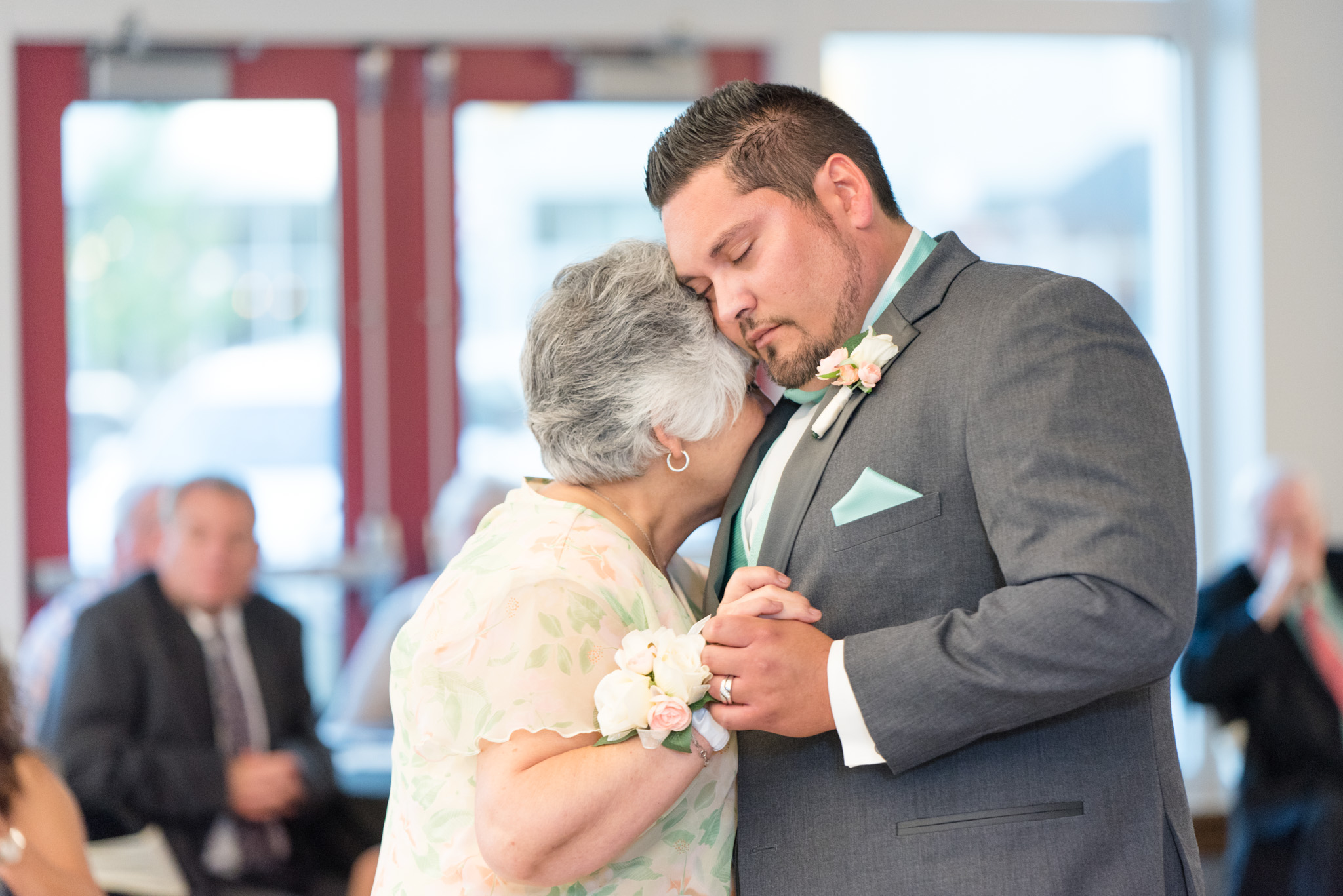 Groom dances with his mother.