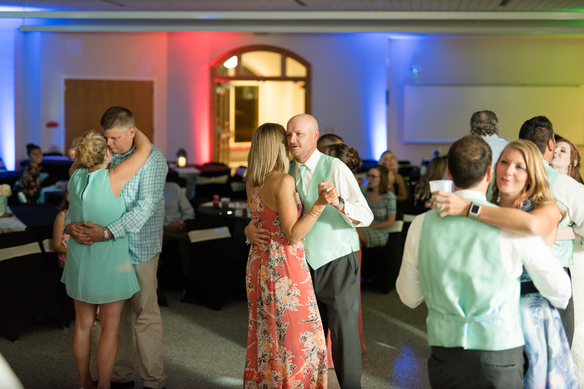 Couples dance at wedding reception.