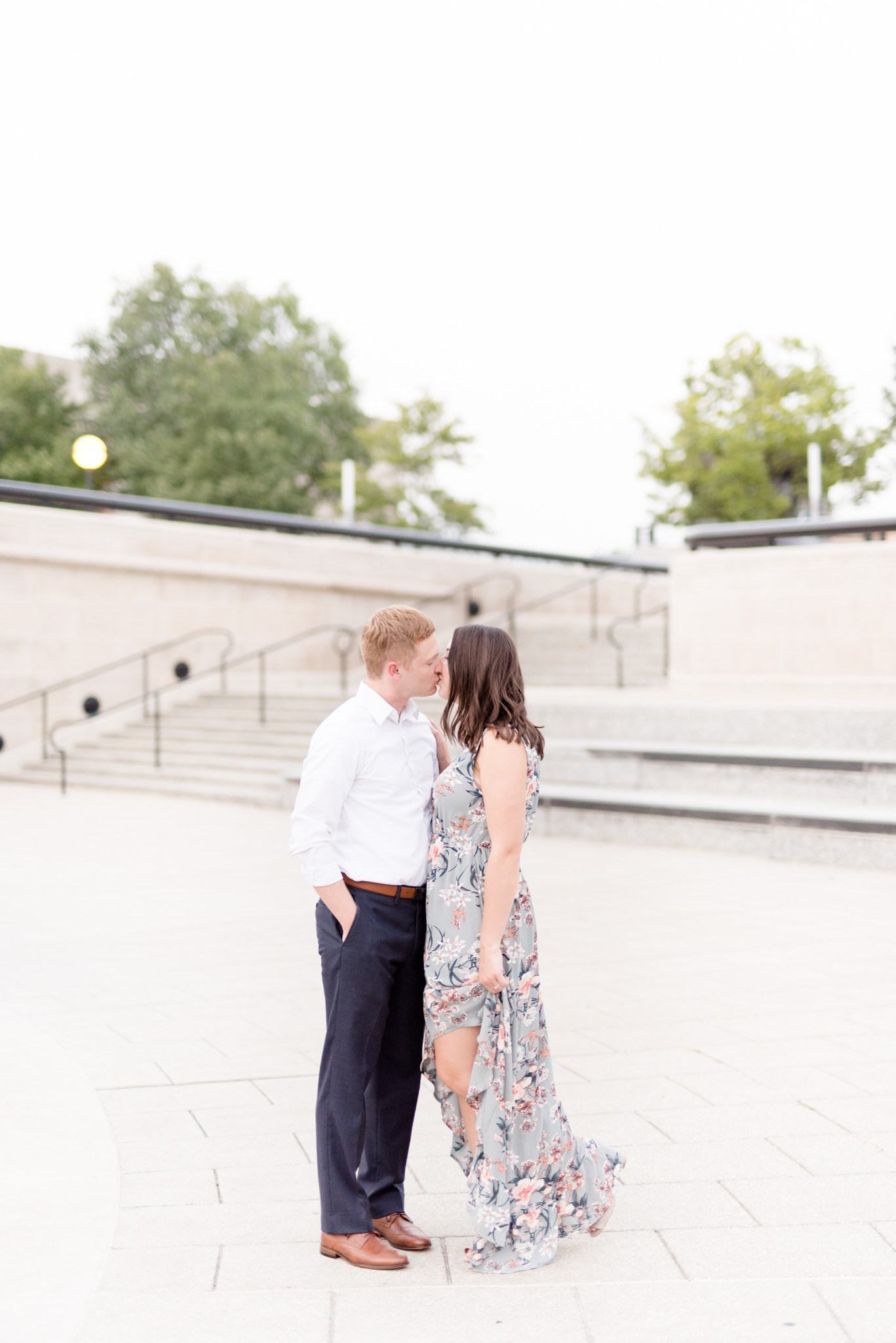 Engaged couple kisses in downtown Indianapolis.