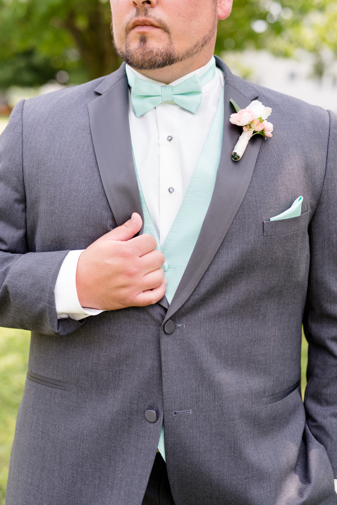 Closeup of groom's suit.