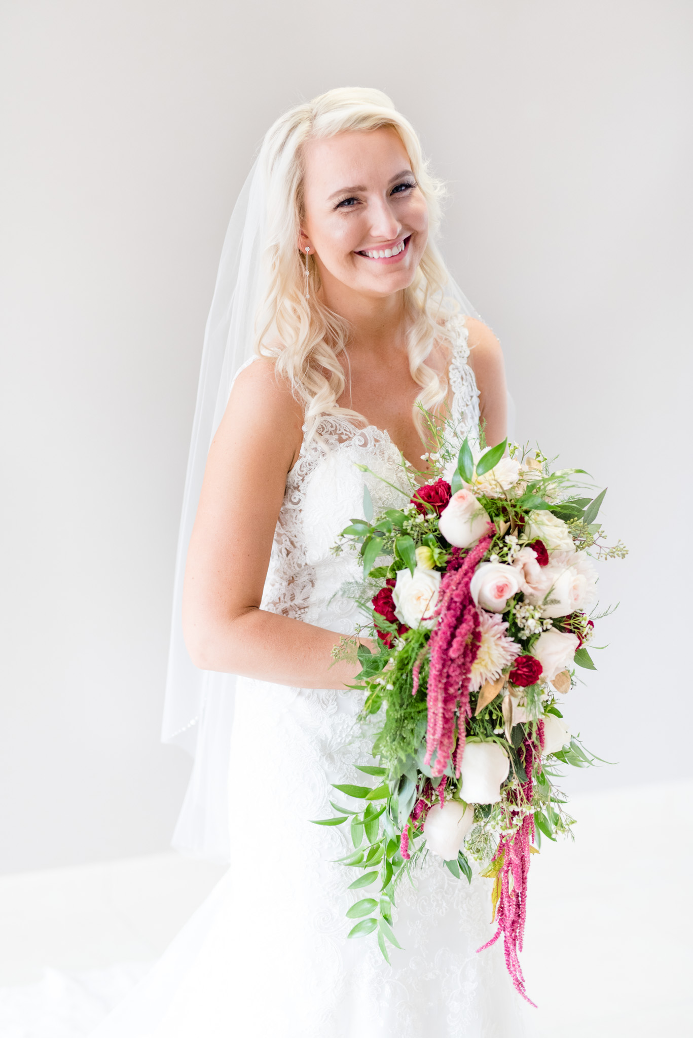 Bride smiles at camera.