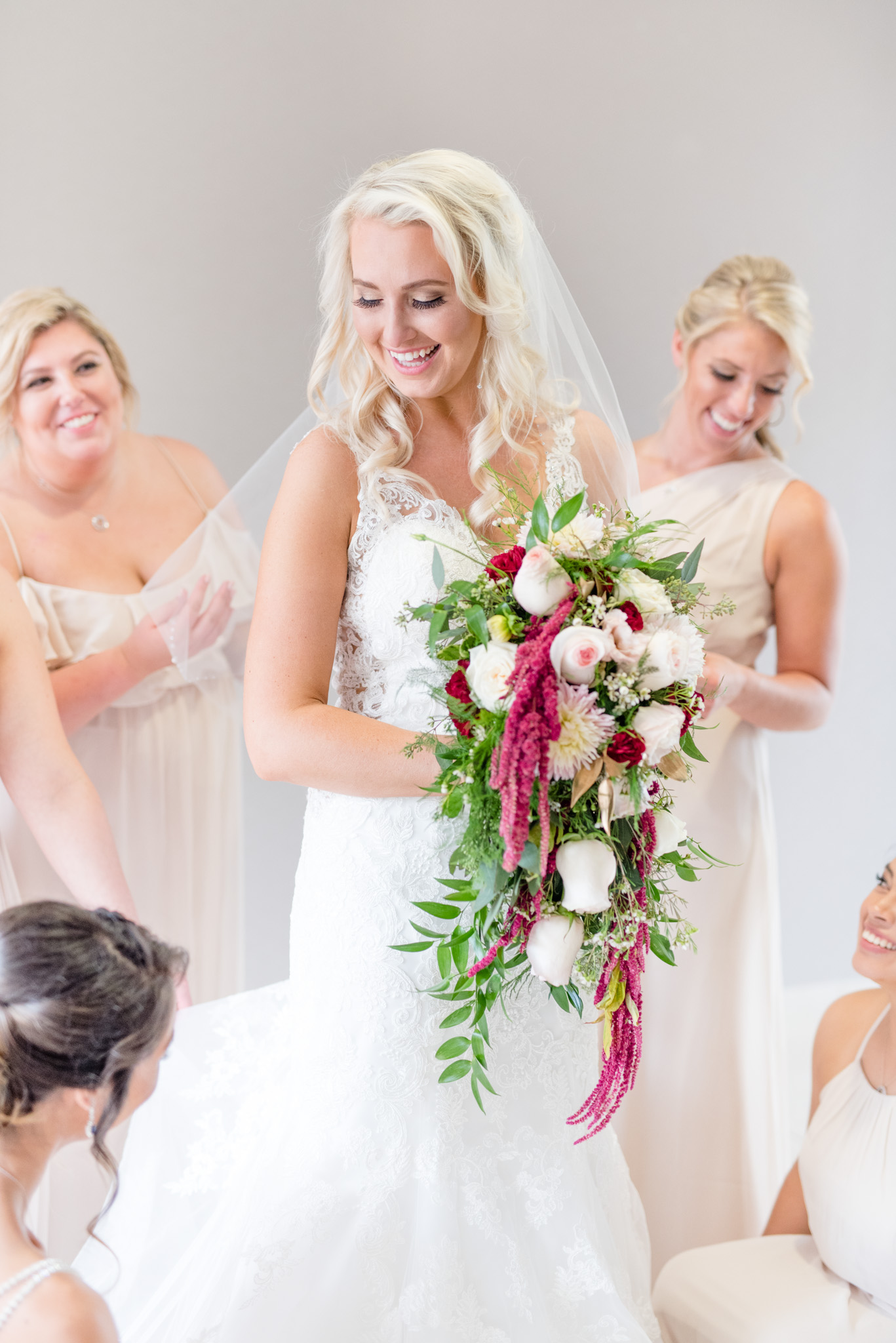 Bride laughs with friends.