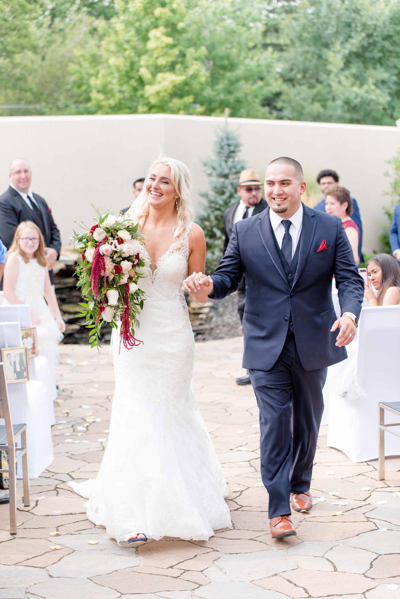 Bride and groom walk up the aisle.