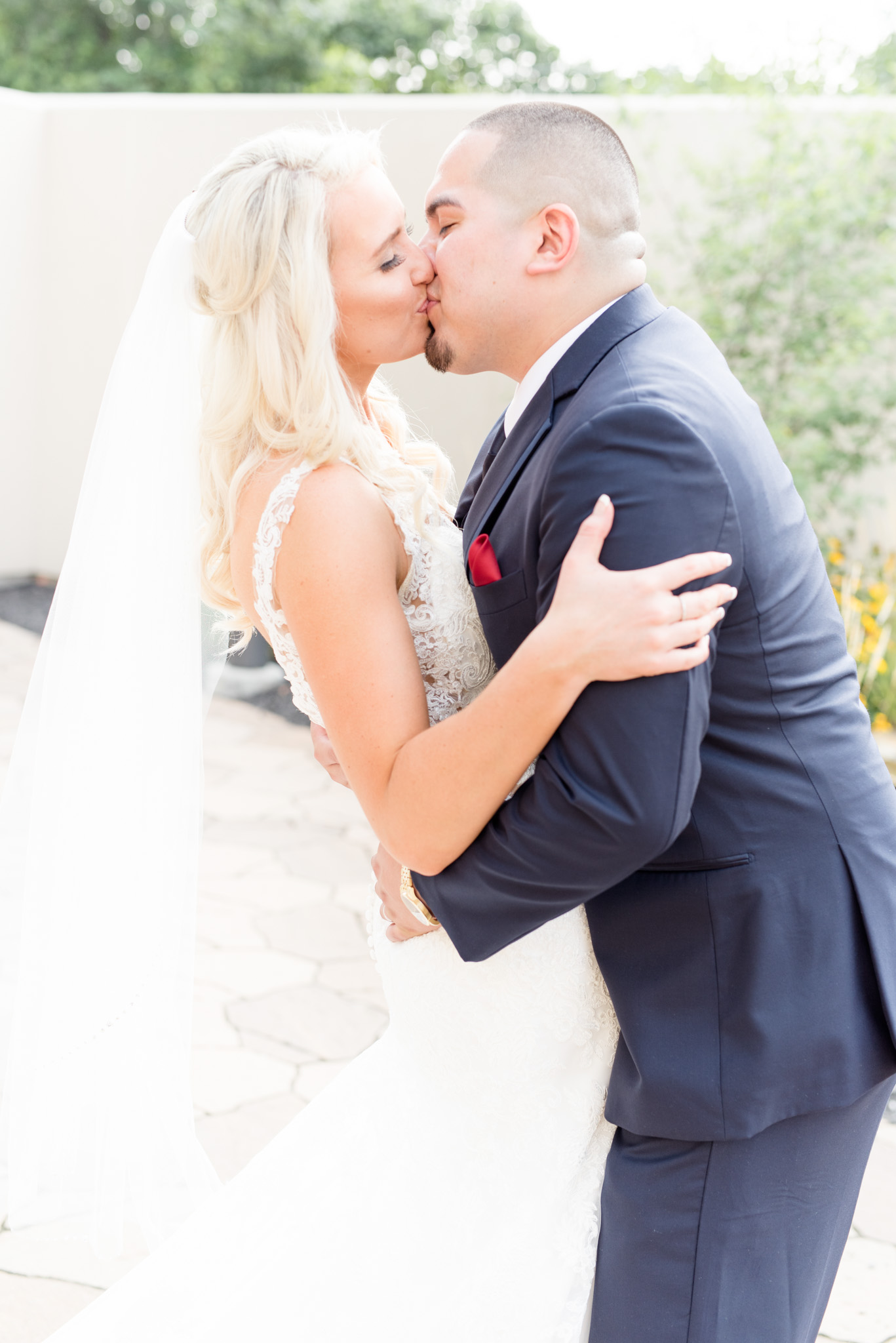 Bride and groom kiss.