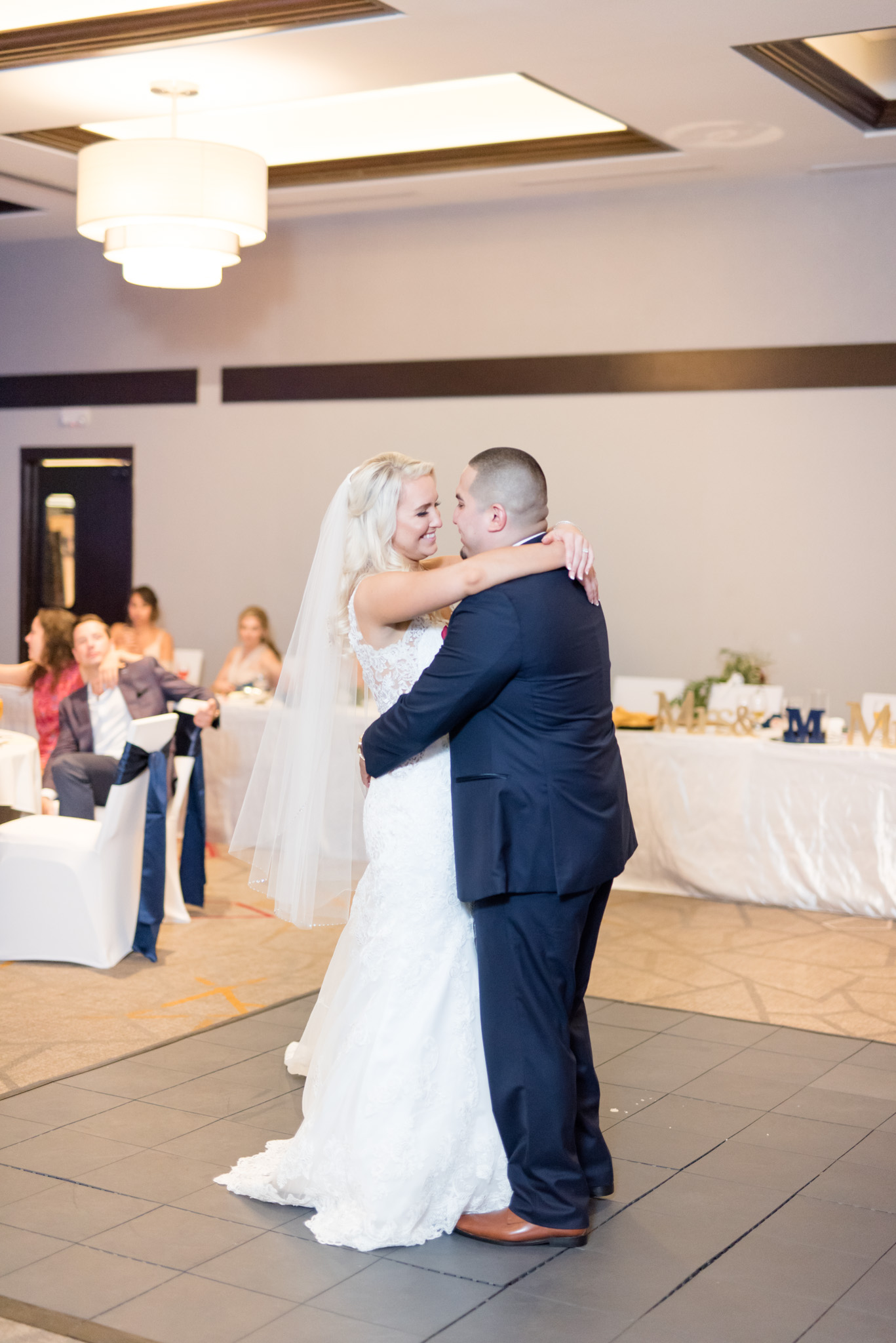 Bride and groom dance.