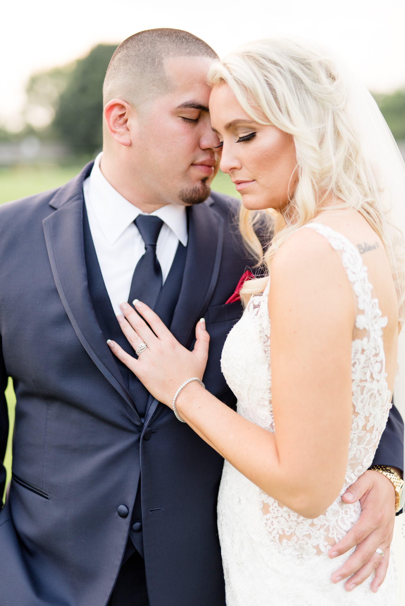 Bride and groom snuggle.