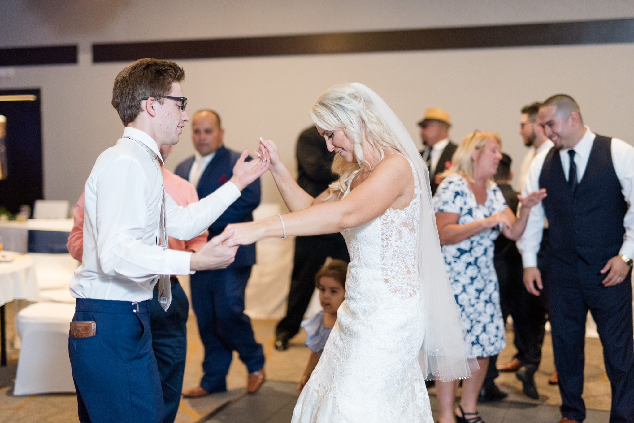 Bride and brother dance.