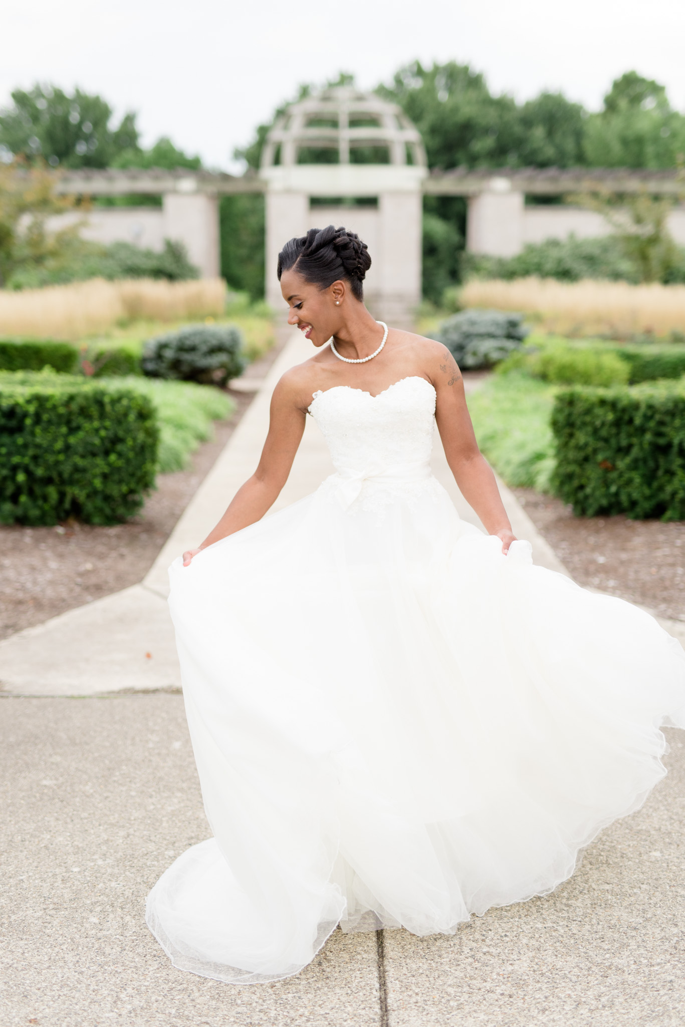 Bride twirls wedding dress.