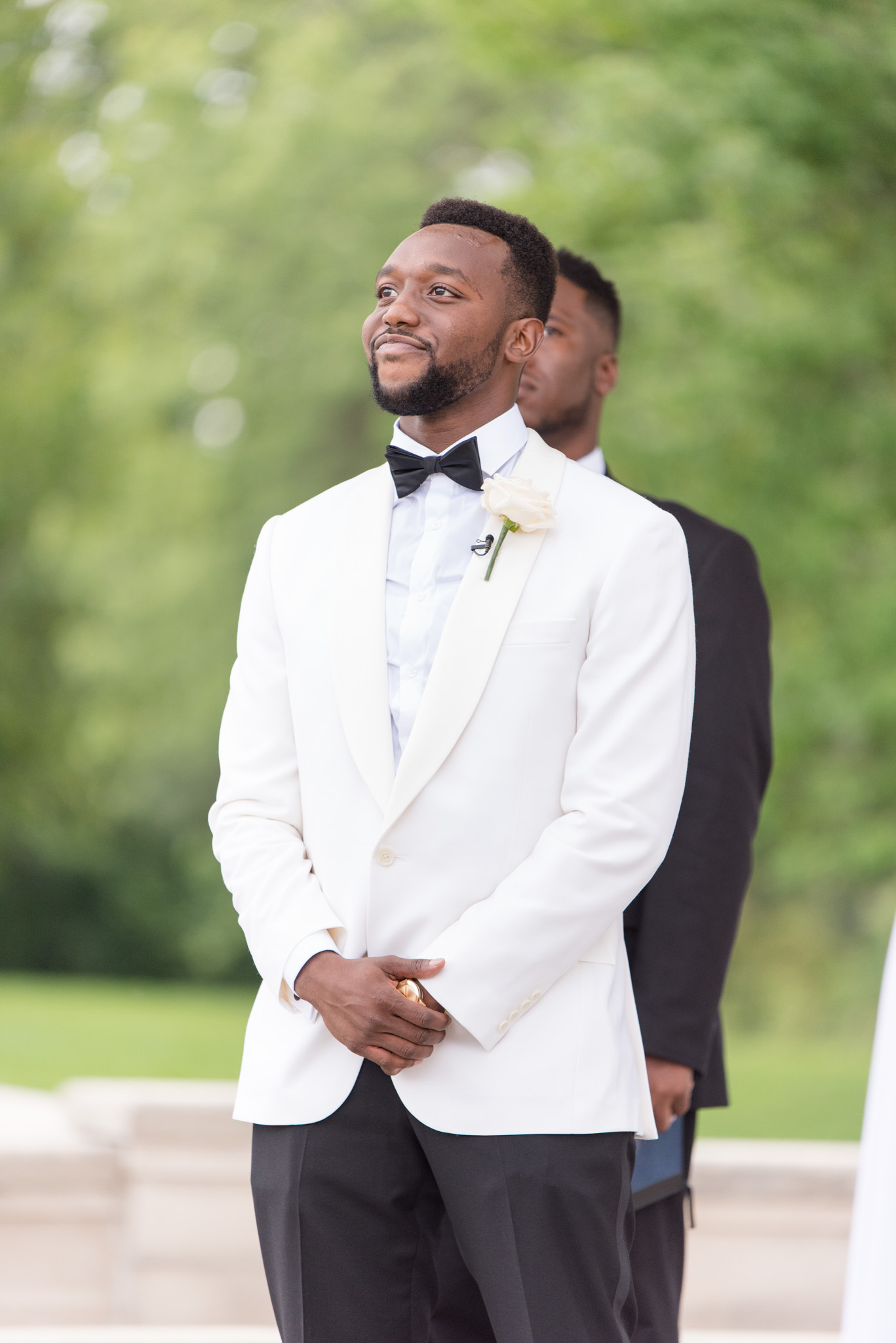Groom smiles when he sees the bride.