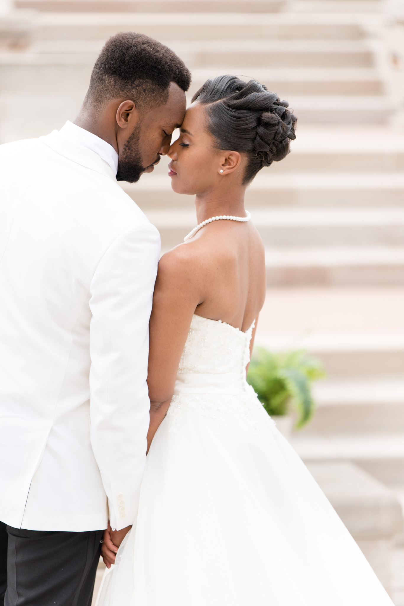 Bride and groom snuggle close.