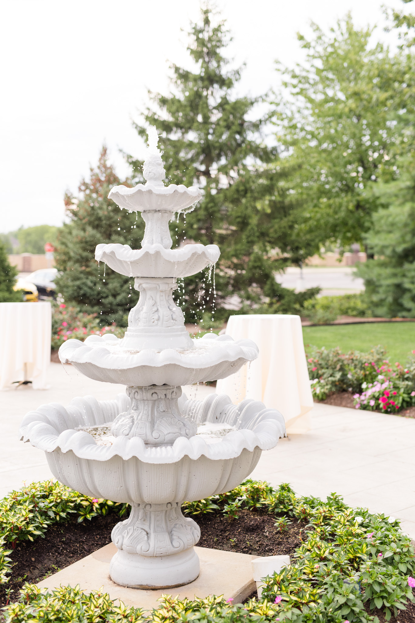 Large stone fountain in garden.