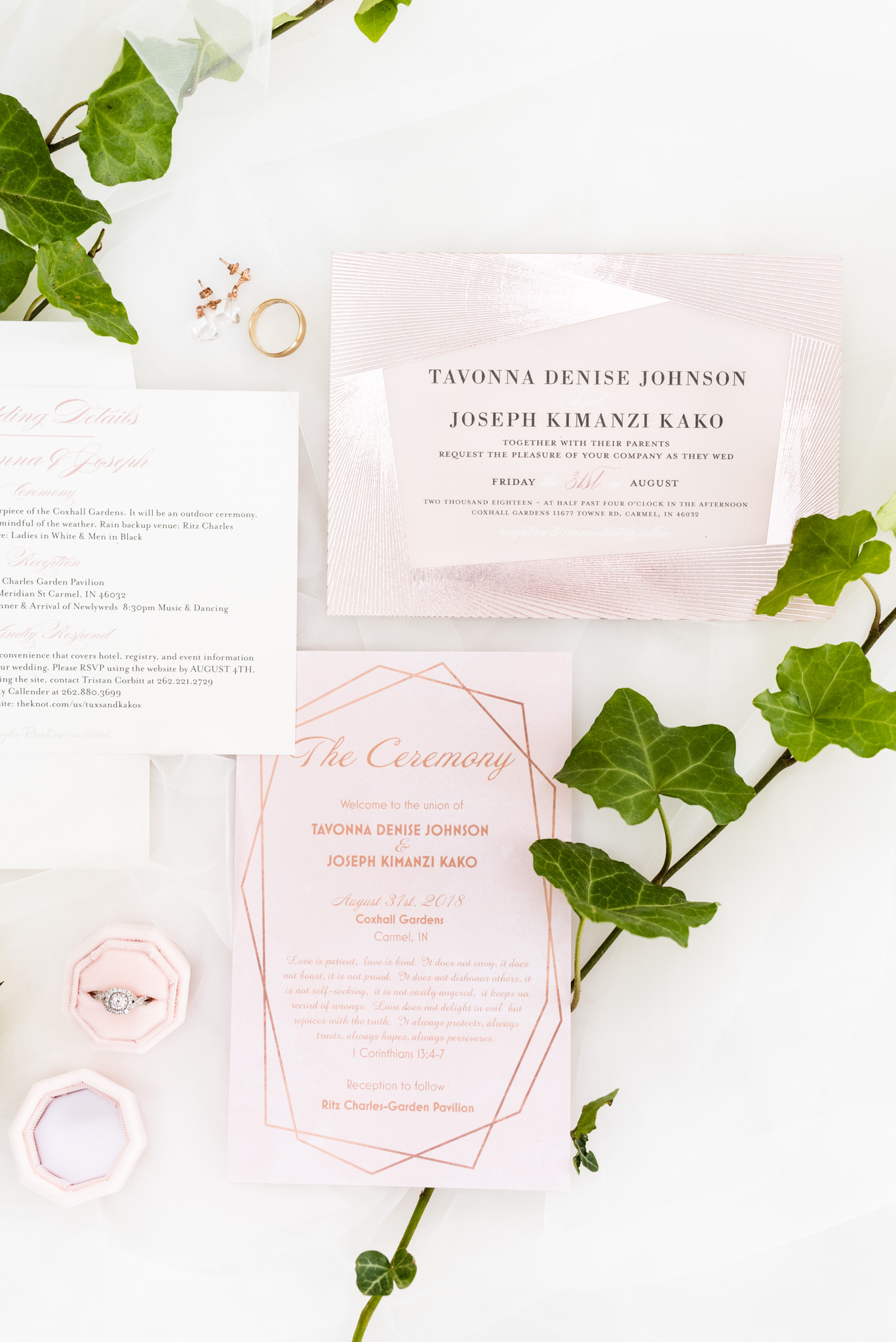 Wedding invitations sit on cloth.