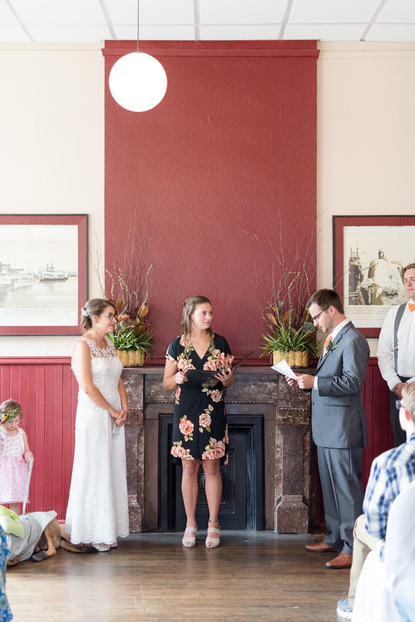 Groom reads vows to bride.