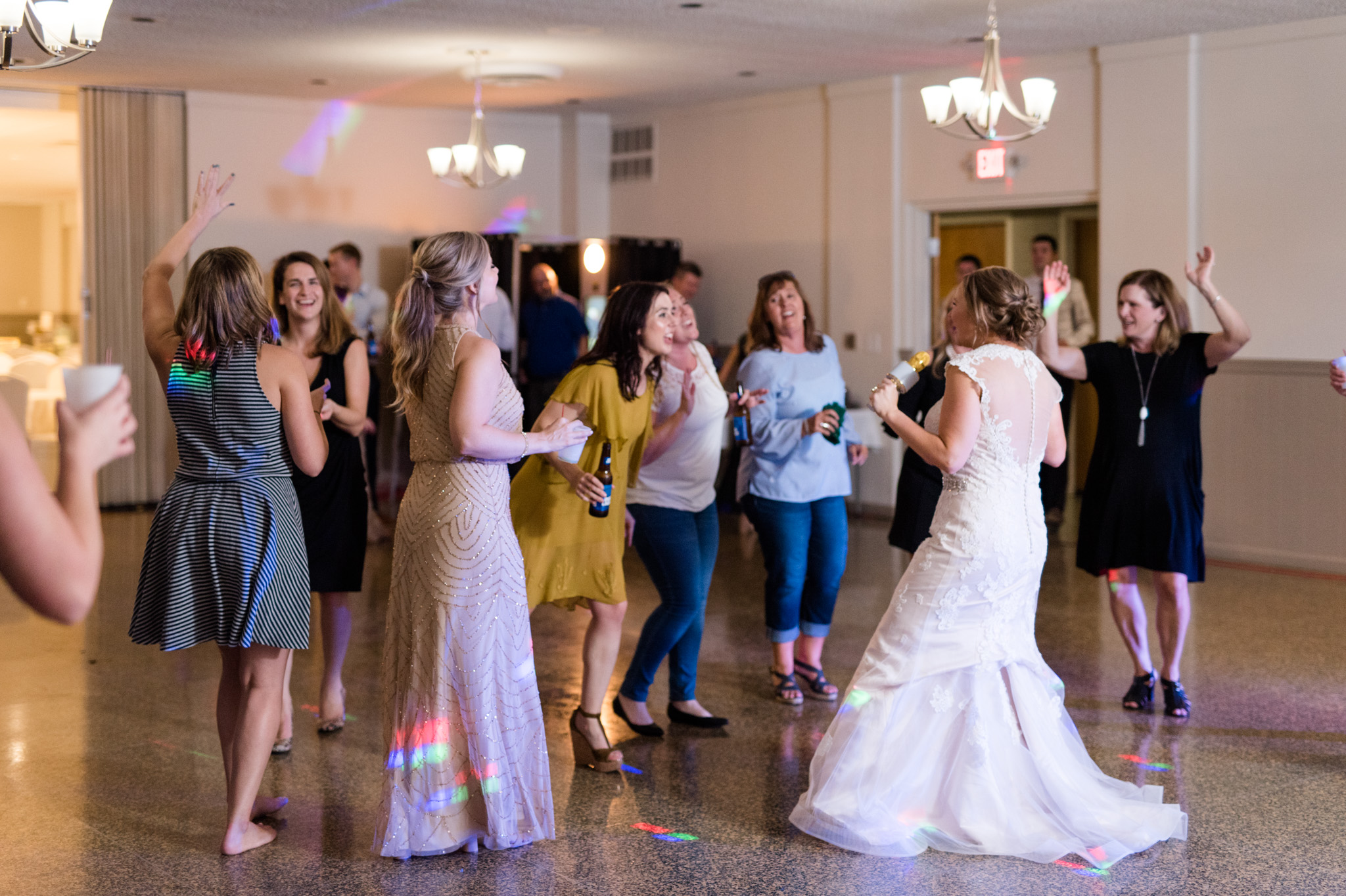 Bride dances with wedding guests.