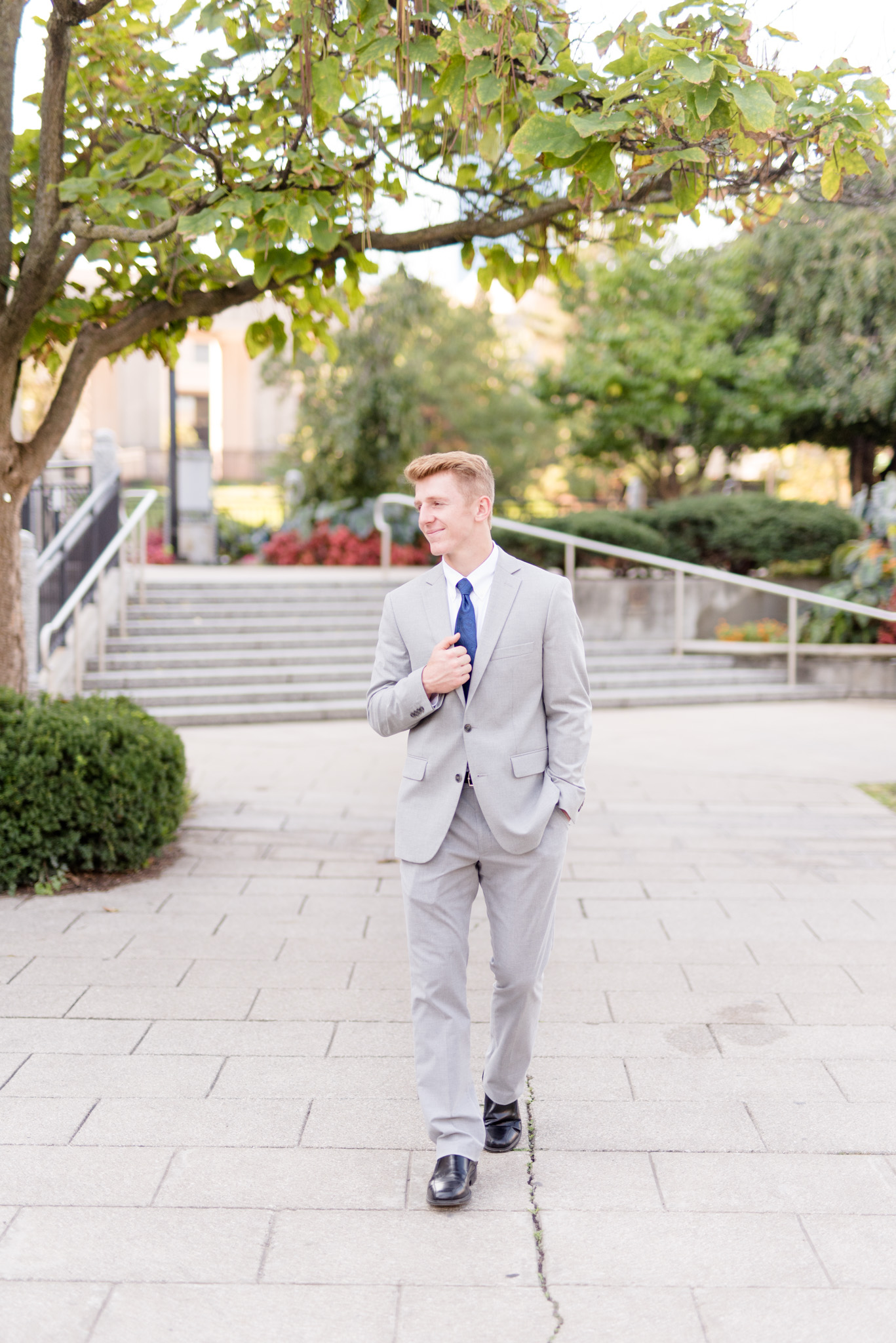 Senior guy looks off camera and walks down lane.