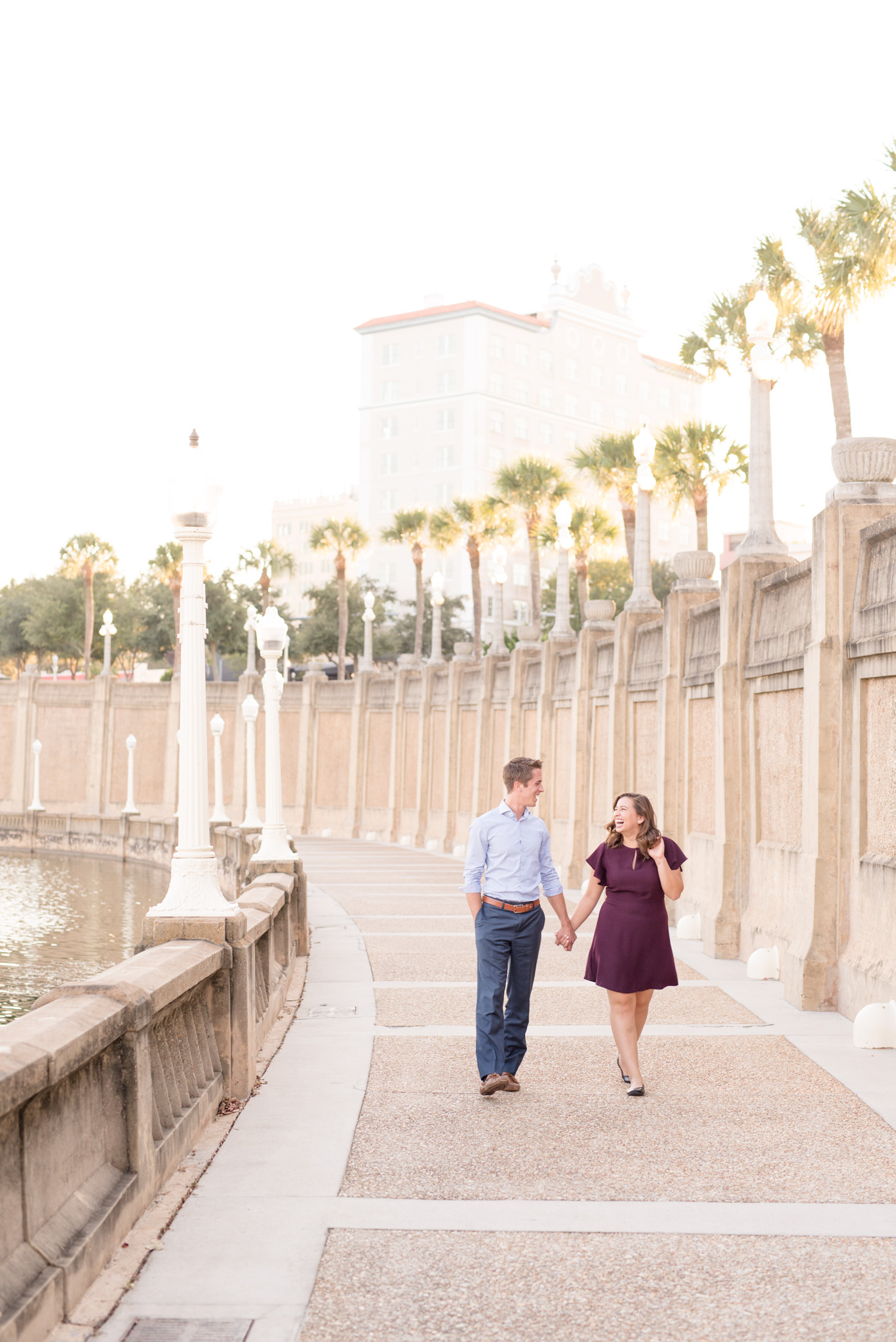 Couple walks along stone path.