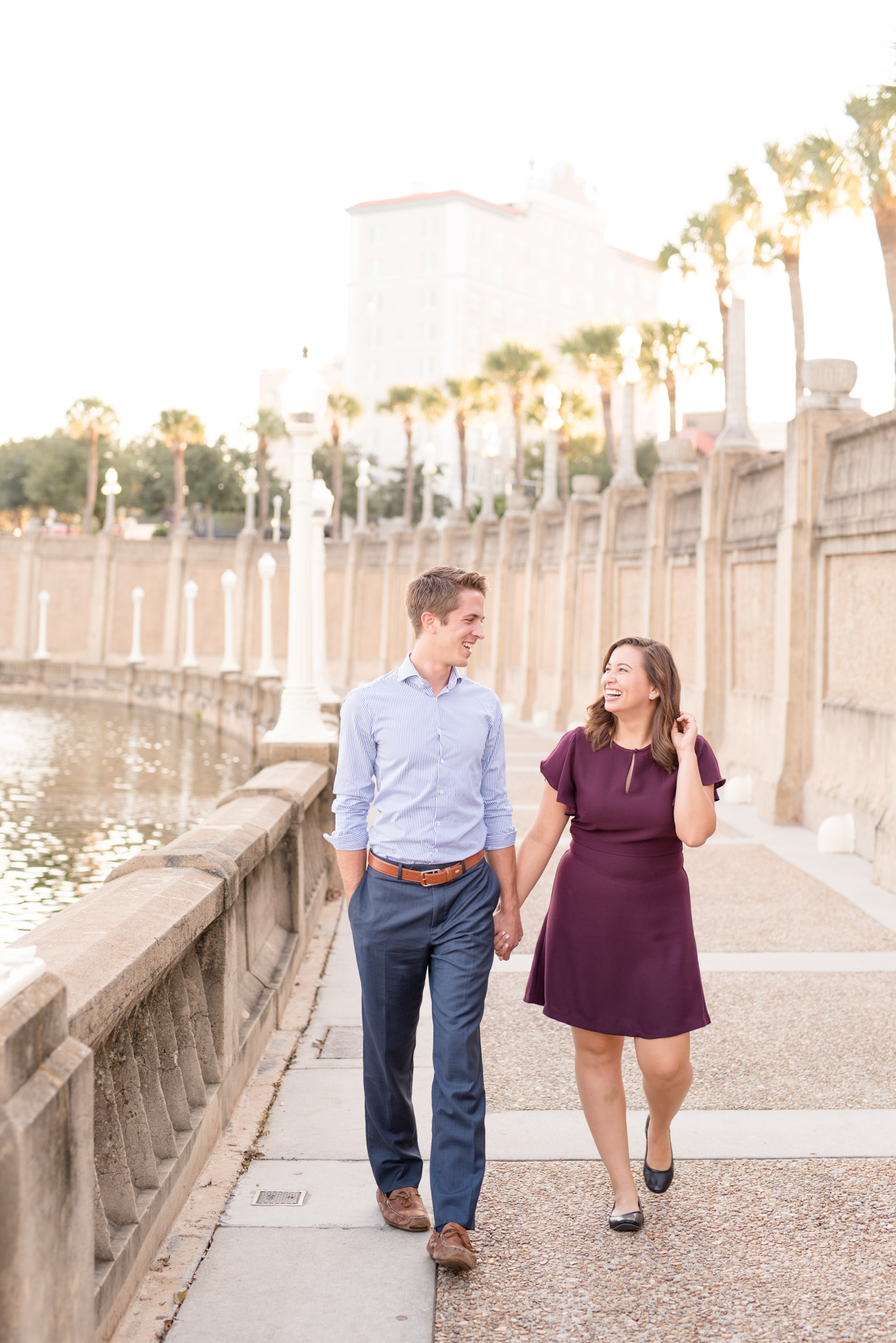 Couple walks at sunset.