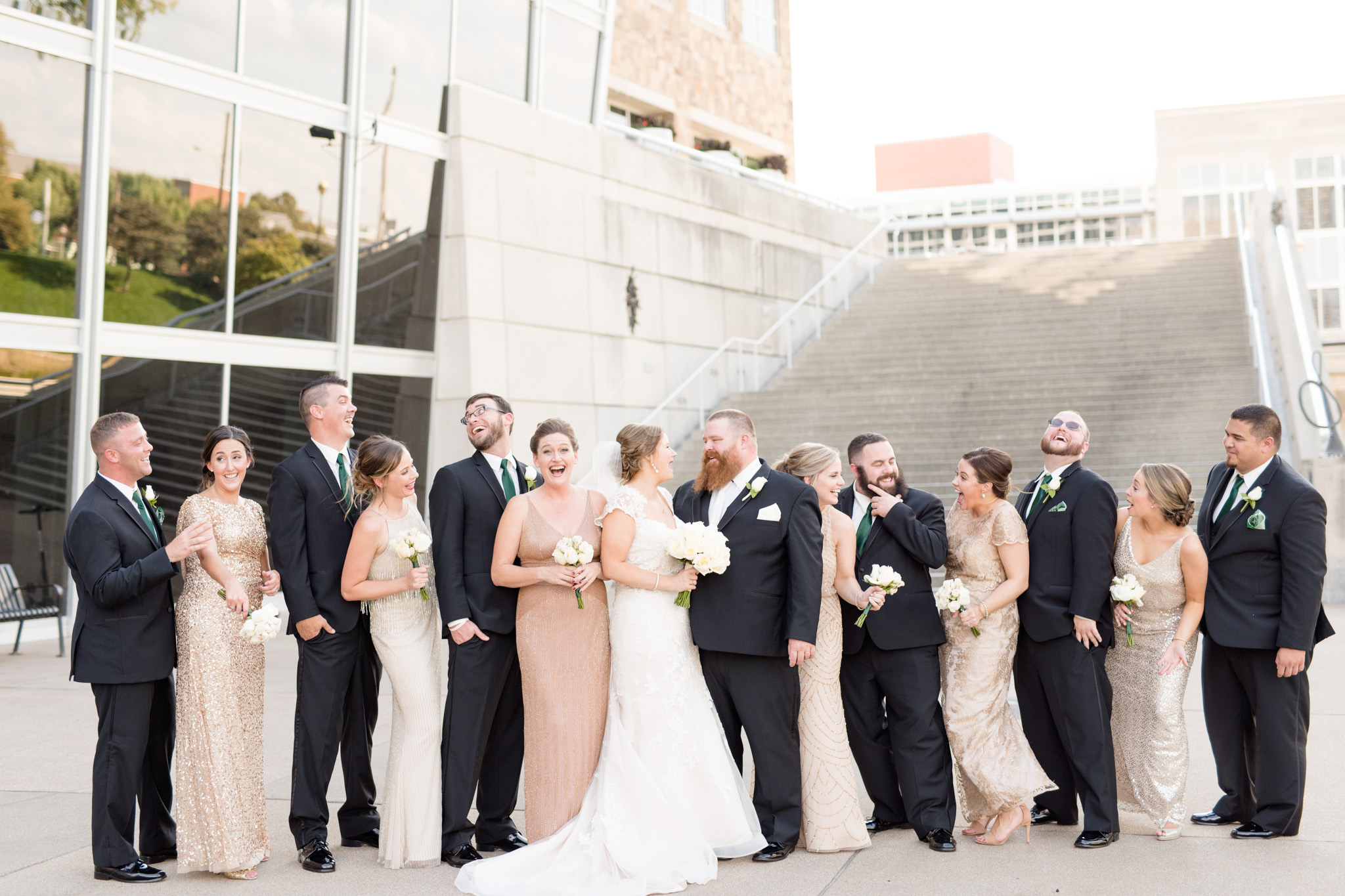 Wedding party laughs together in downtown Indianapolis.