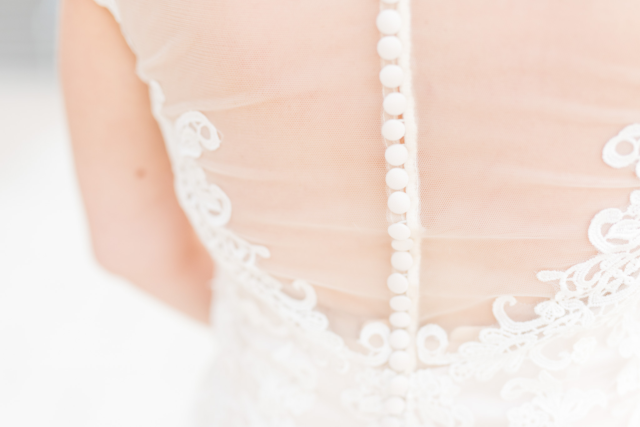 Buttons on the back of wedding dress.